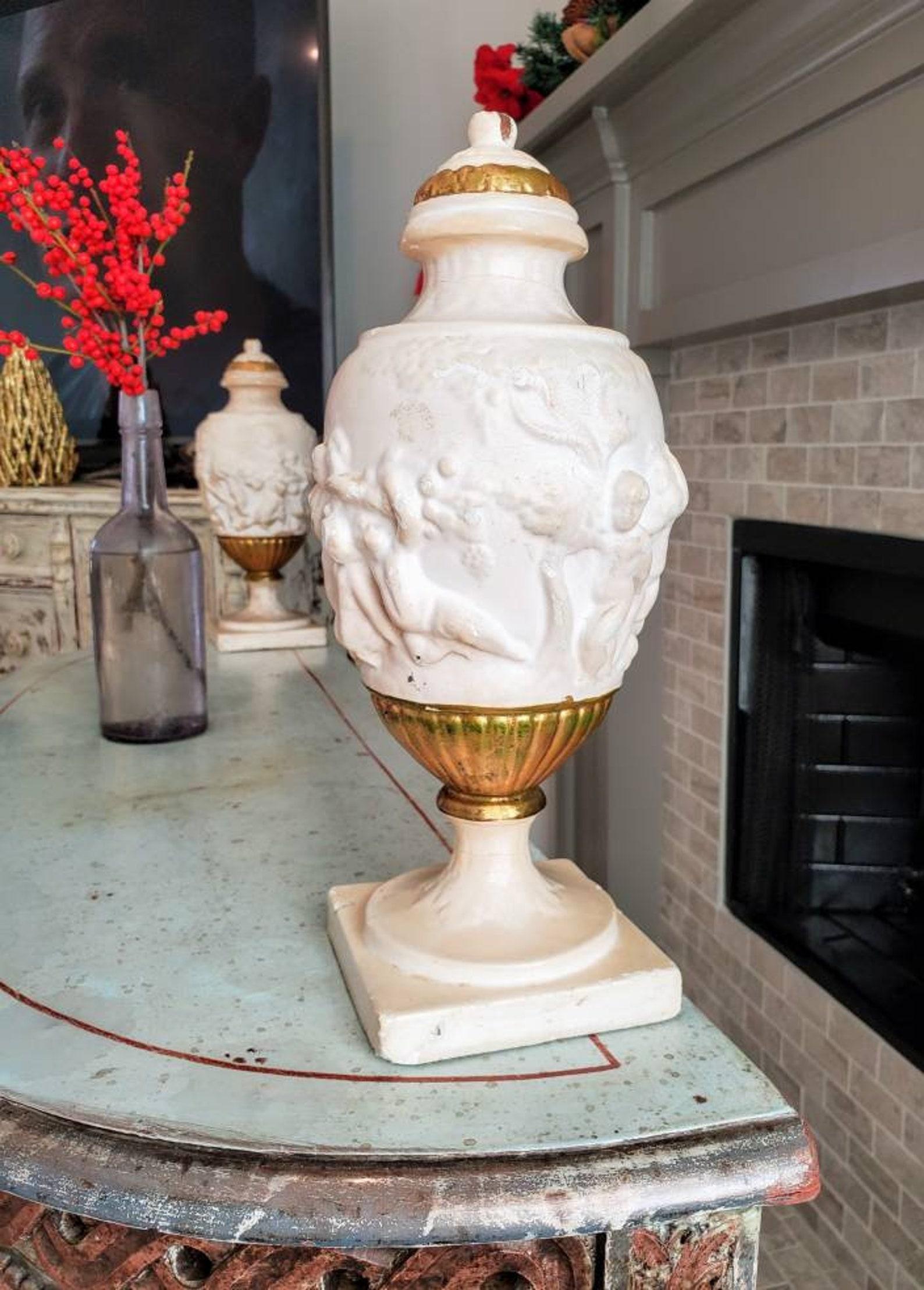 A stunning pair of antique Italian Neo-classical faux marble wooden urns.

Born in Italy around the 18th/early 19th century, sculptural lidded urn architectural element form, hand carved from a single block of wood, exquisitely decorated in