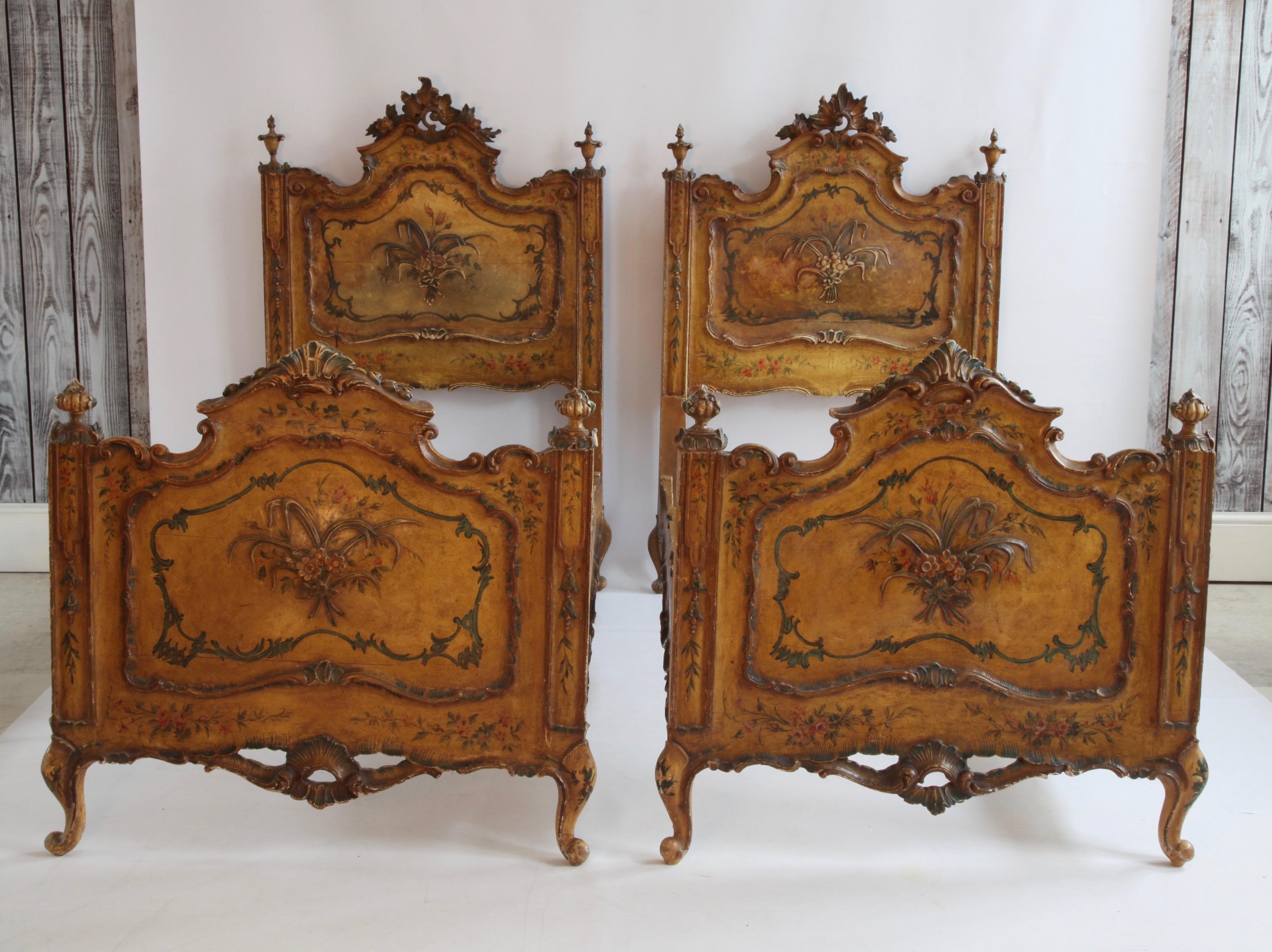 Pair of antique Venetian single beds.
Painted in Yellow ochre with floral motifs all around.