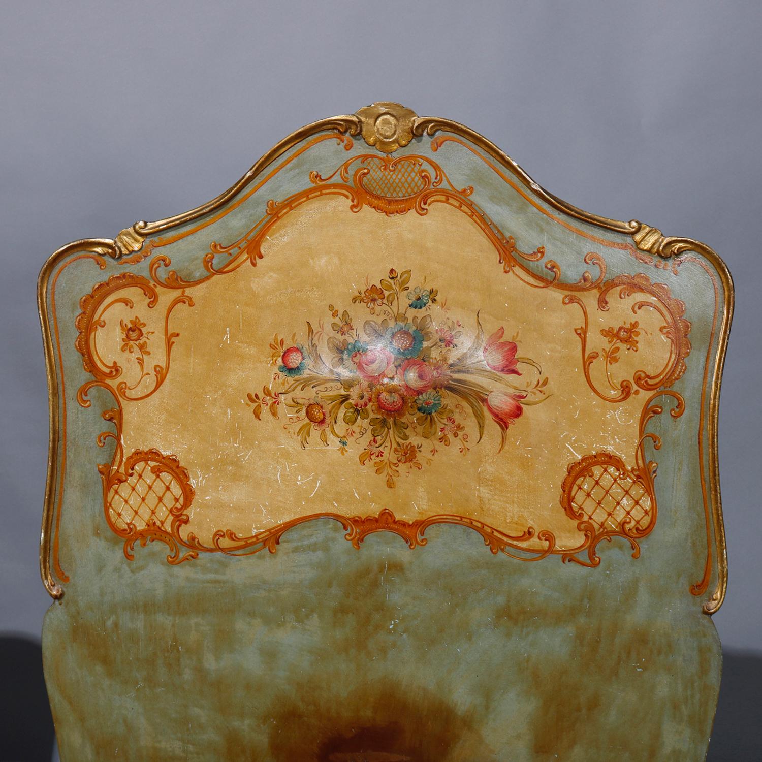 A pair of antique Italian Rococo twin bed frames offer shaped head and foot boards with central hand painted floral reserves, scroll, foliate, gadroon and gilt highlights, raised on cabriole legs, circa 1930.

Measures: fr: 52