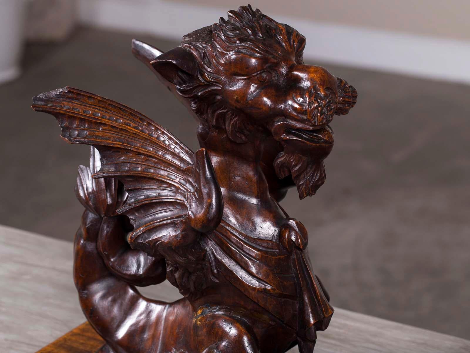 This pair of fabulous antique Italian winged griffin gryphon carvings from Italy circa 1780 are a rare lot. Sculptural in effect and meant to be seen from all directions these representations of the mythological beast of the air, the winged griffin,