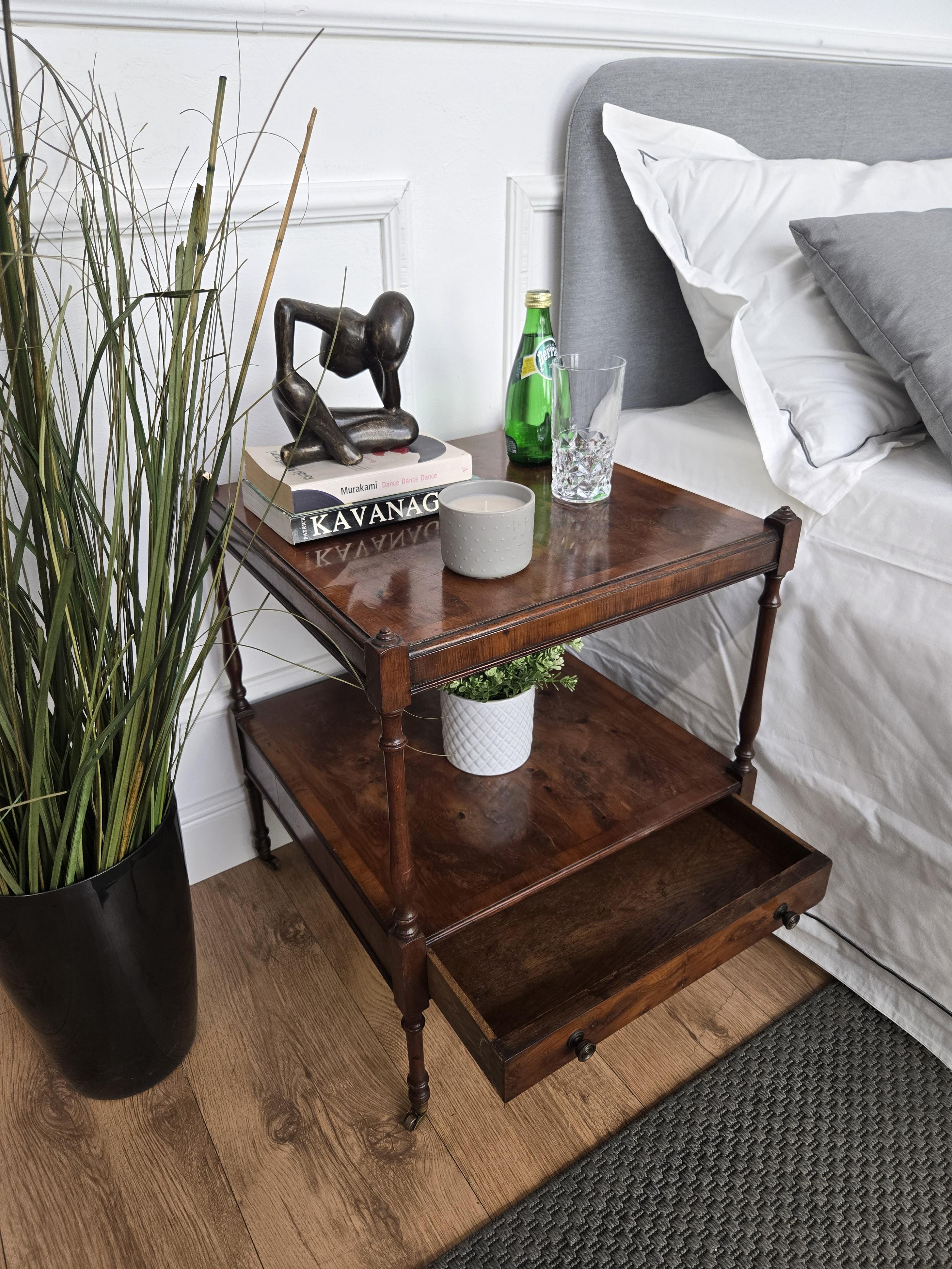 Very elegant and refined Italian antique pair of bedside tables with double layer and bottom drawers with brass handles and wheels. Great attention to detail in the decorated, refined and framed sides, surfaces and fronts, carved legs and overall