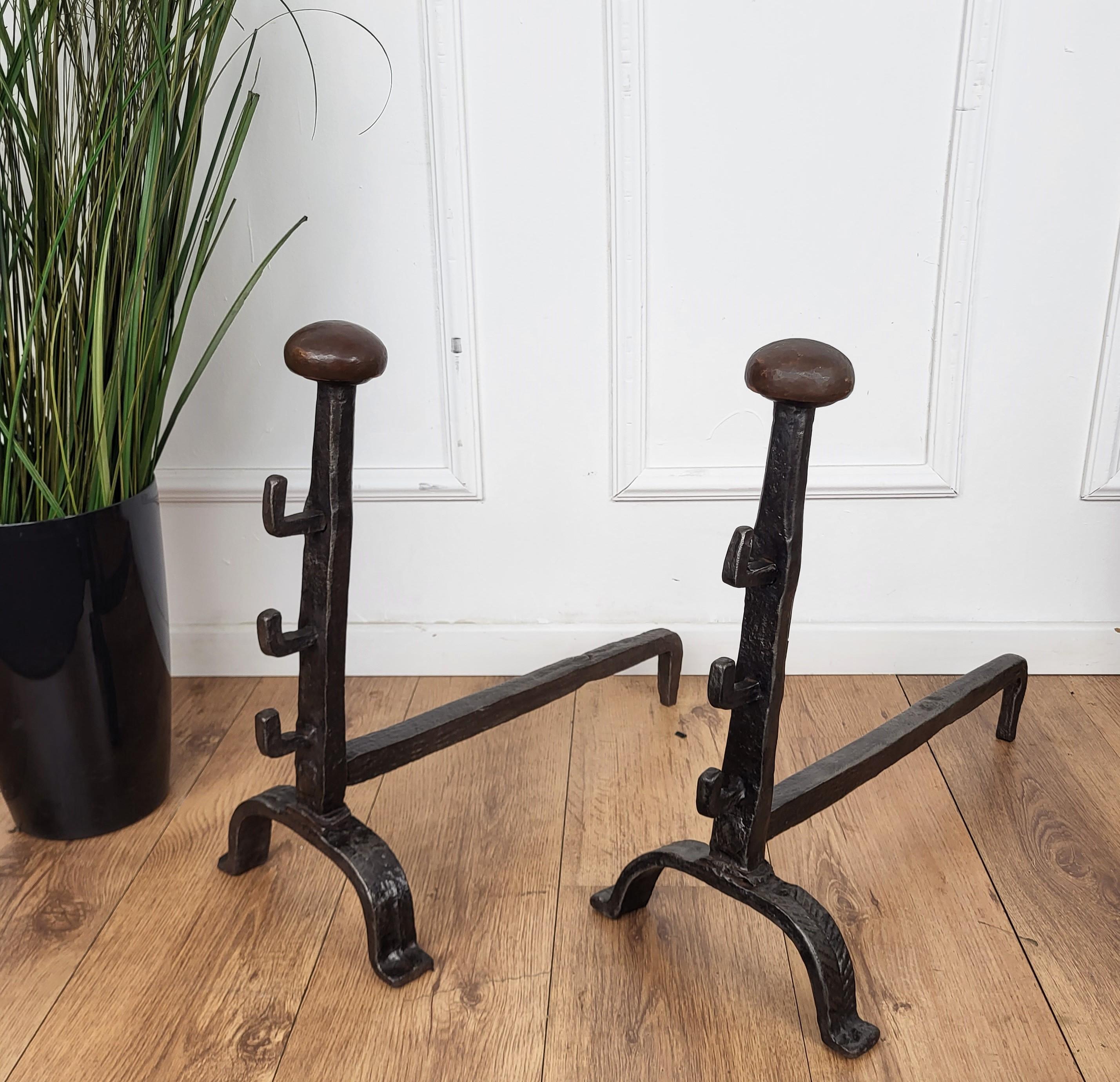 Antique wrought iron Italian andirons log holder, having two beautiful classic shapes with the great handmade craftmanship typical for wrought-iron and the back pillars.