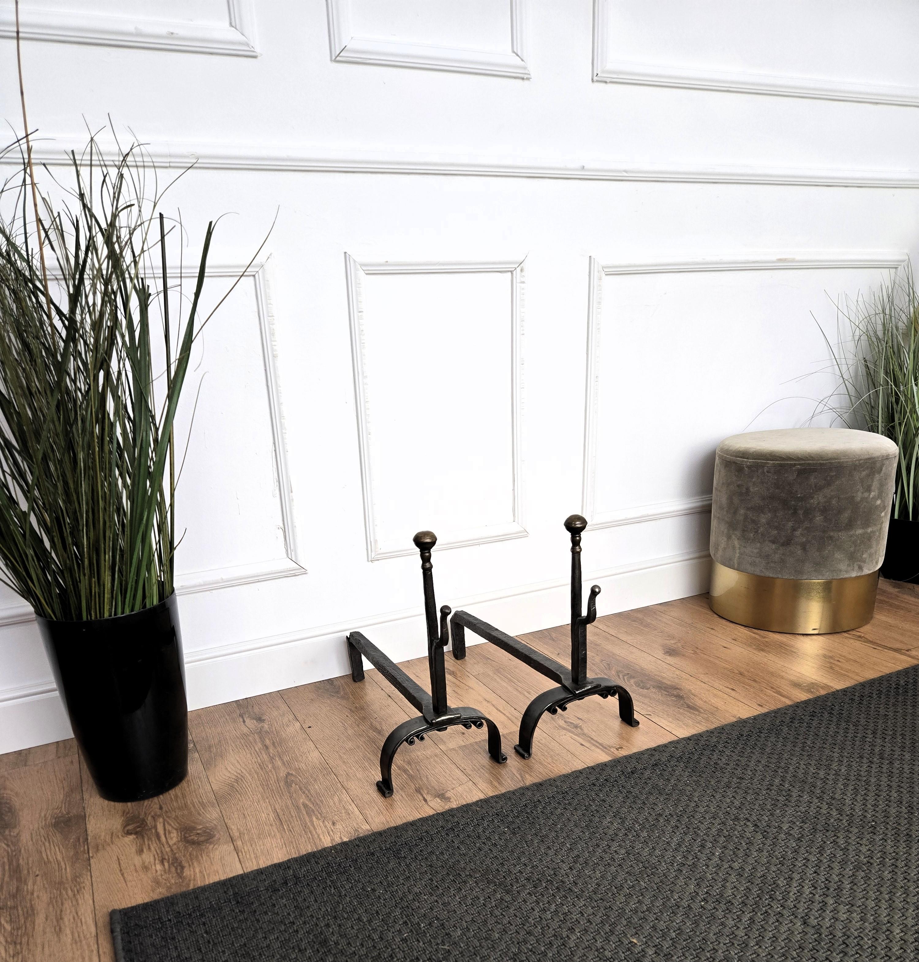 Antique wrought iron Italian andirons log holder, having two beautiful classic shapes with the great handmade craftmanship typical for wrought-iron and the back pillars.