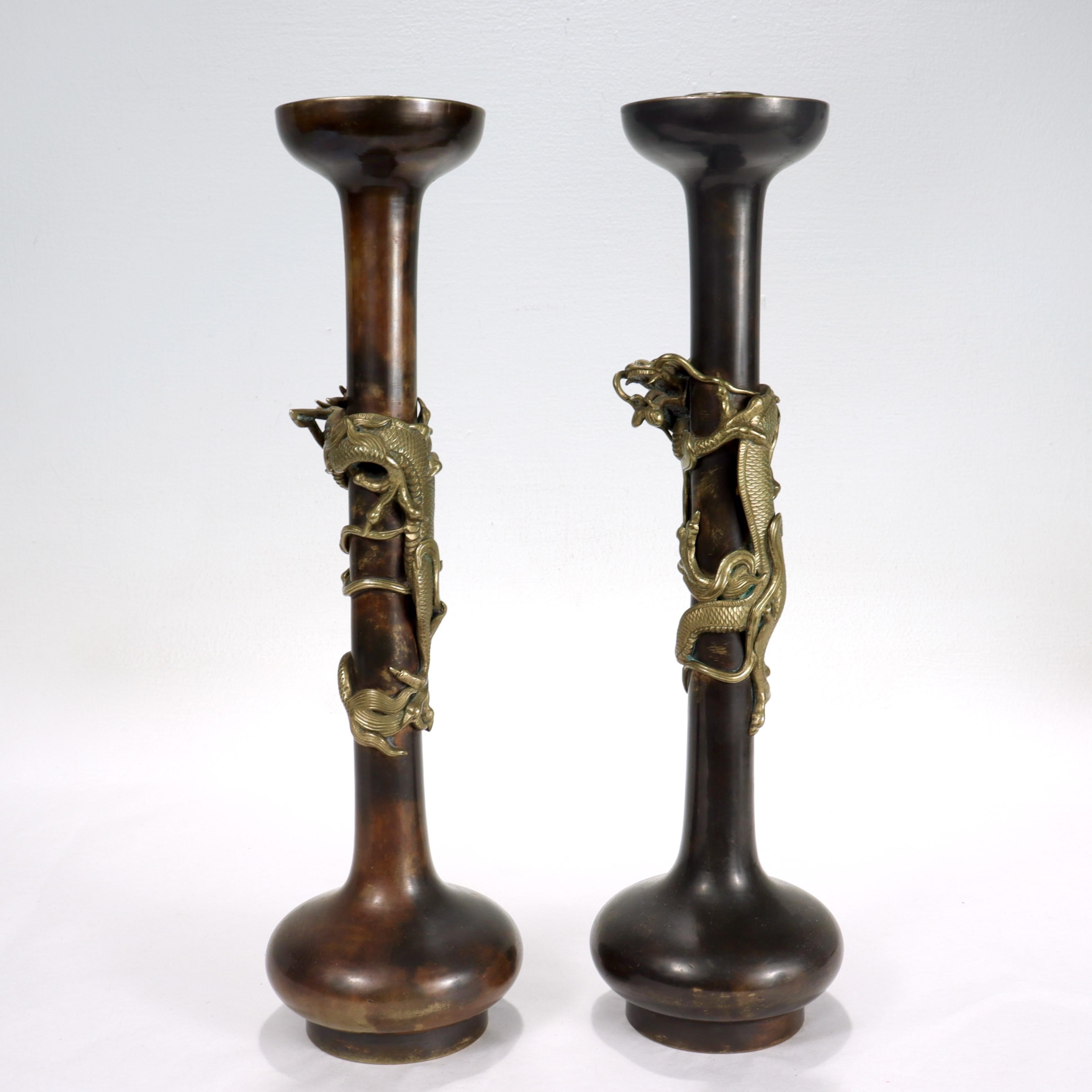 Pair of Antique Japanese Bronze Candlesticks with Coiled Dragons In Good Condition For Sale In Philadelphia, PA