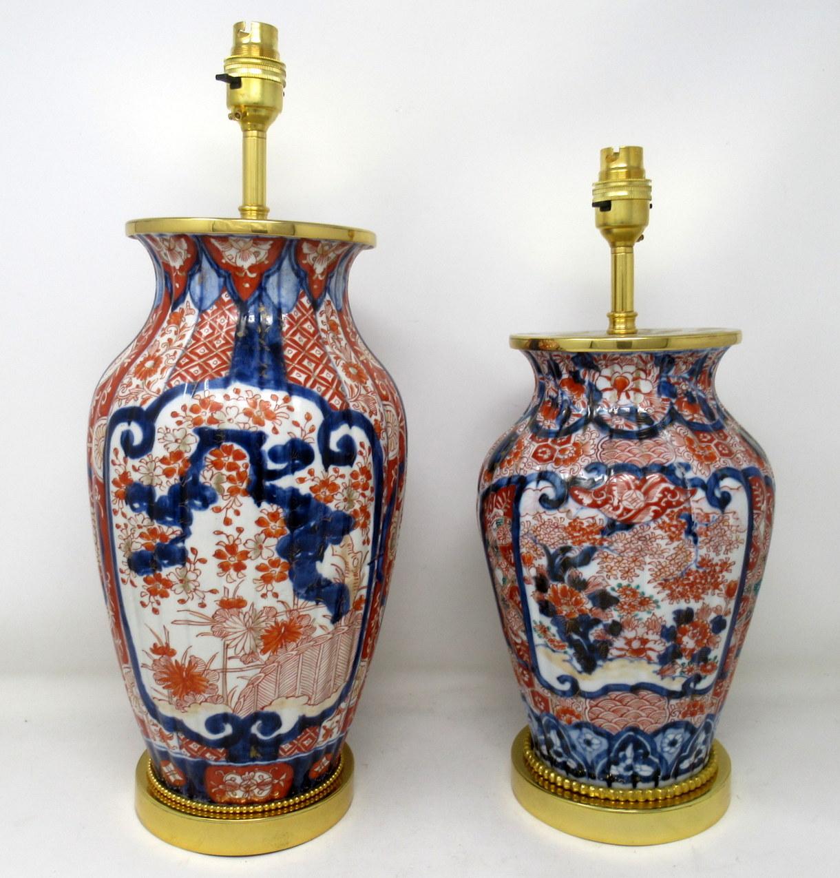 Stunning matched pair of traditional Japanese Imari porcelain ovoid form glazed porcelain vases, now converted to a pair of electric table lamp, complete with later ormolu circular stepped bases. third quarter of the nineteenth century.

The main