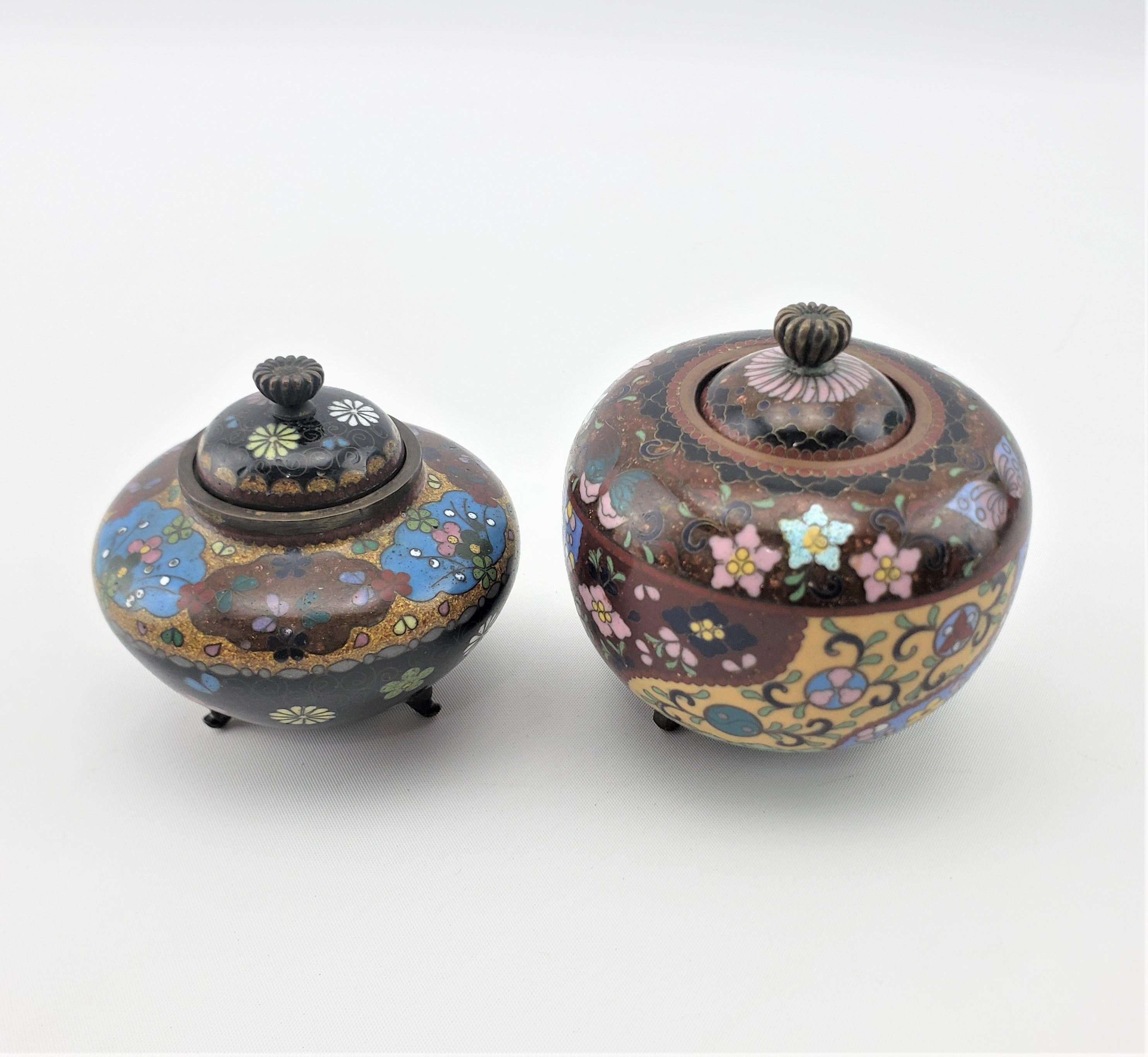 Hand-Crafted Pair of Antique Japanese Cloisonne Covered Jars with Floral Motif Decoration For Sale