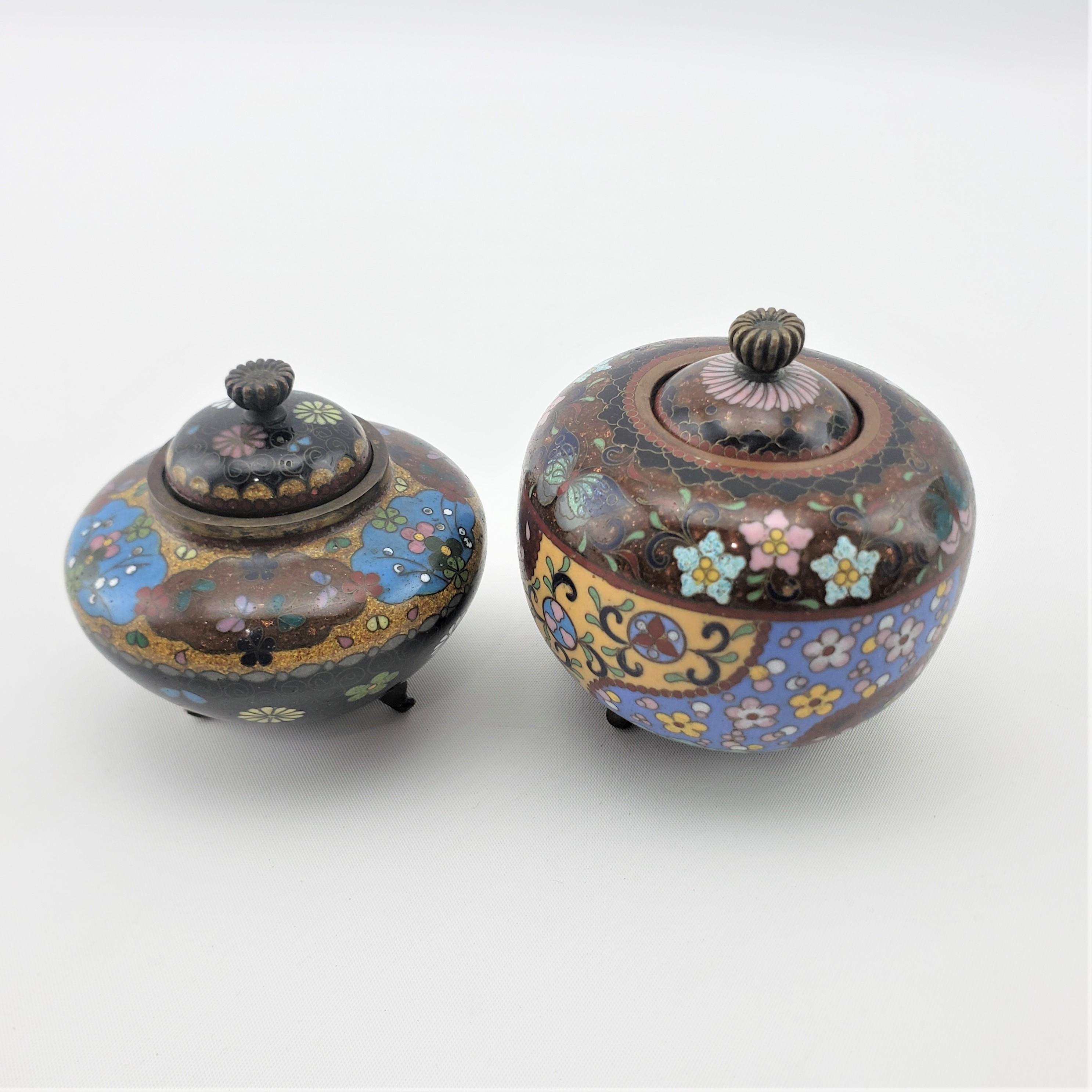 20th Century Pair of Antique Japanese Cloisonne Covered Jars with Floral Motif Decoration For Sale
