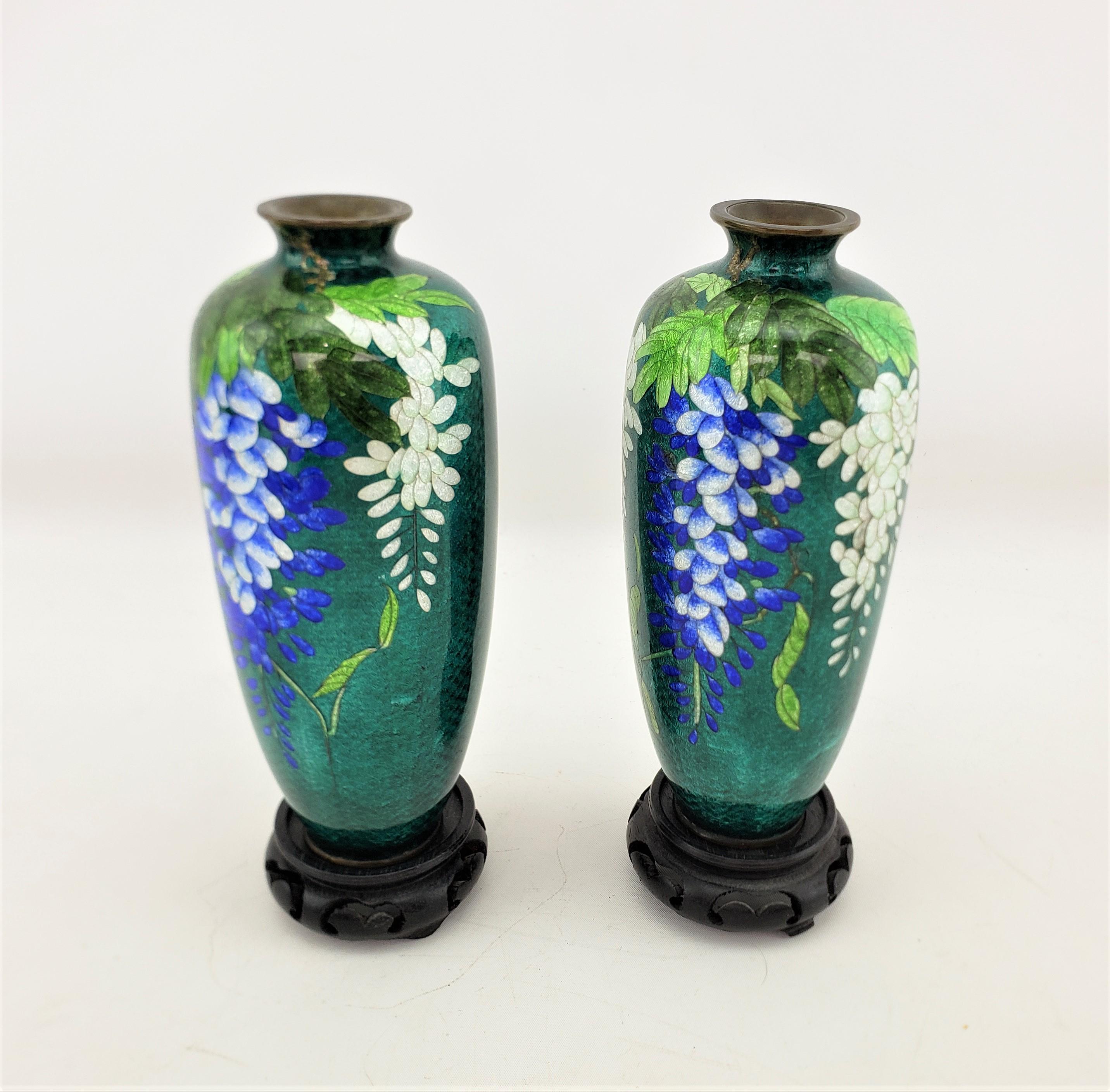 Enameled Pair of Antique Japanese Cloisonne Vases with Floral Decoration & Wooden Stands For Sale