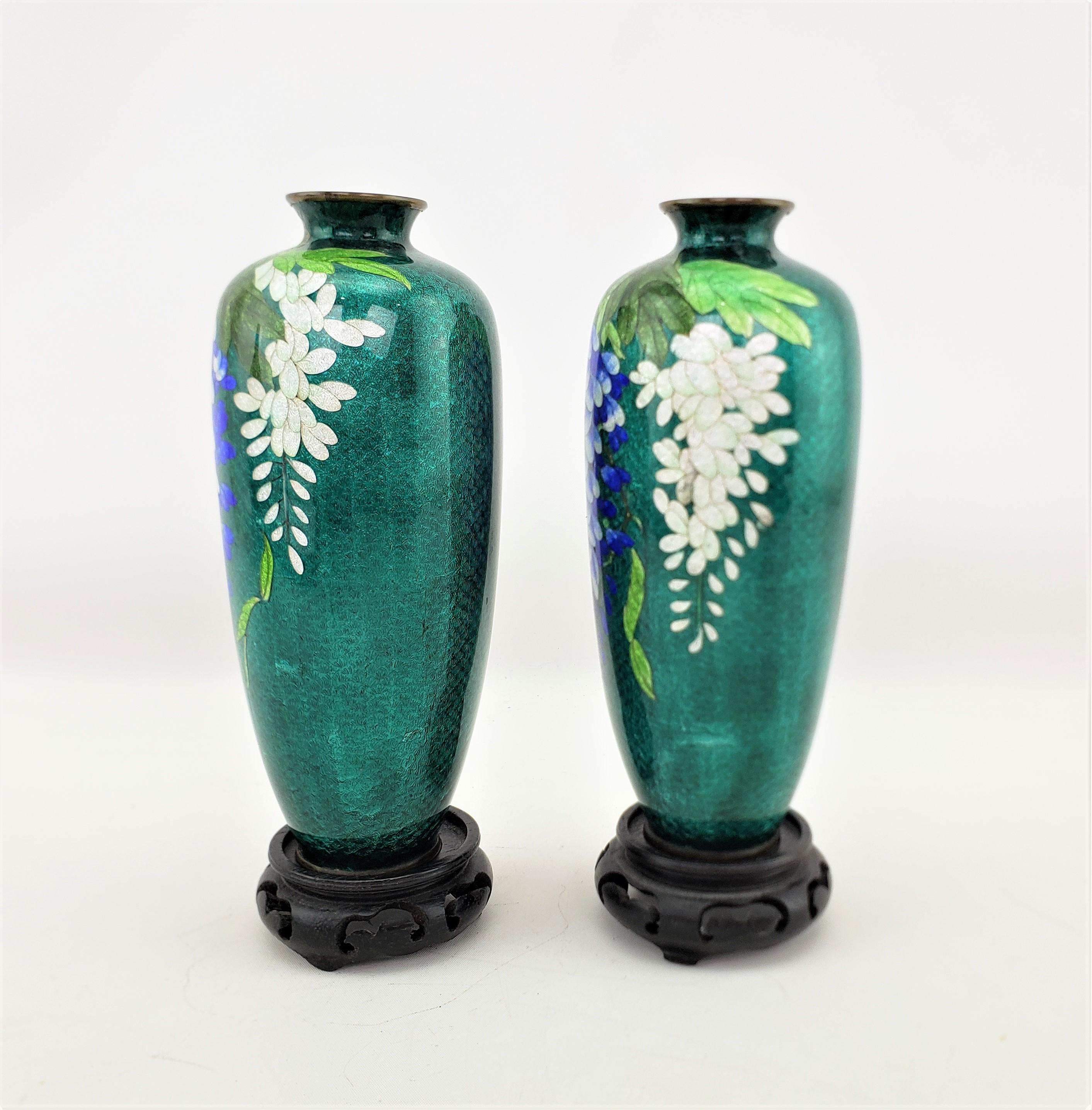 Enameled Pair of Antique Japanese Cloisonne Vases with Floral Decoration & Wooden Stands For Sale