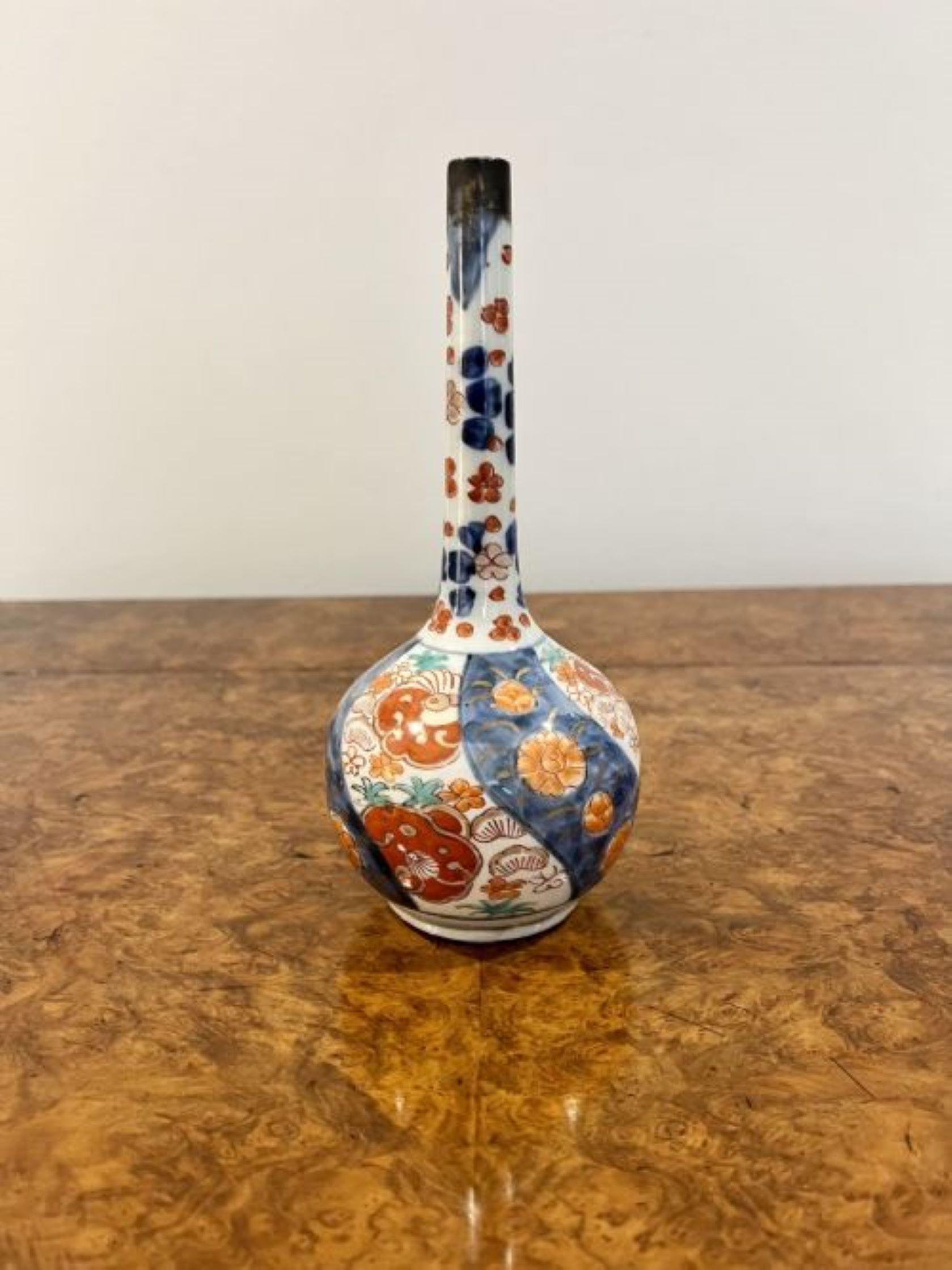 Pair of antique Japanese imari vases. Hand painted imari shaped vases in wonderful red, blue, green, white and gold colours. Restoration to one of the vases as shown 