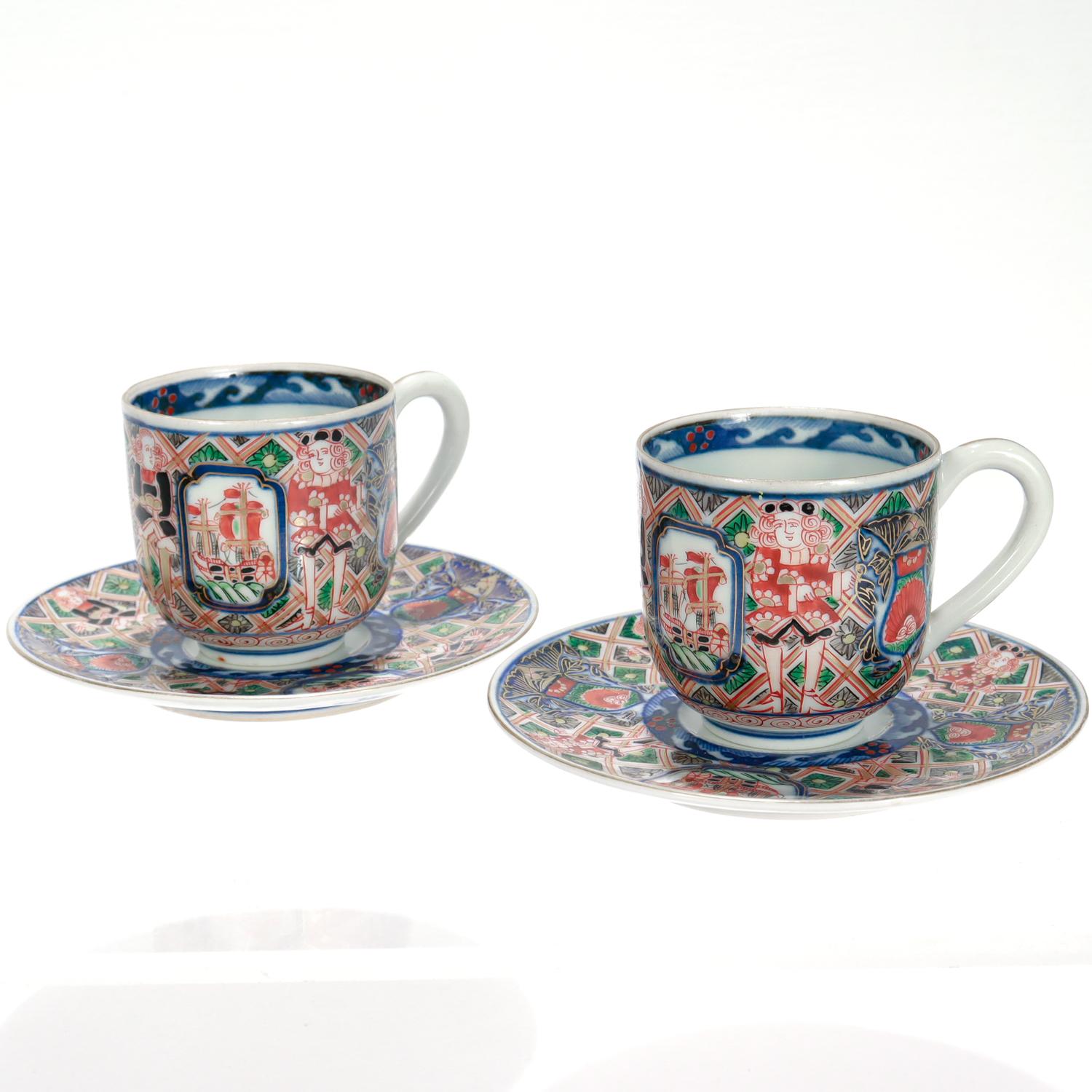 Pair of Antique Japanese Meiji 'Black Ship' Imari Porcelain Cups & Saucers In Good Condition For Sale In Philadelphia, PA