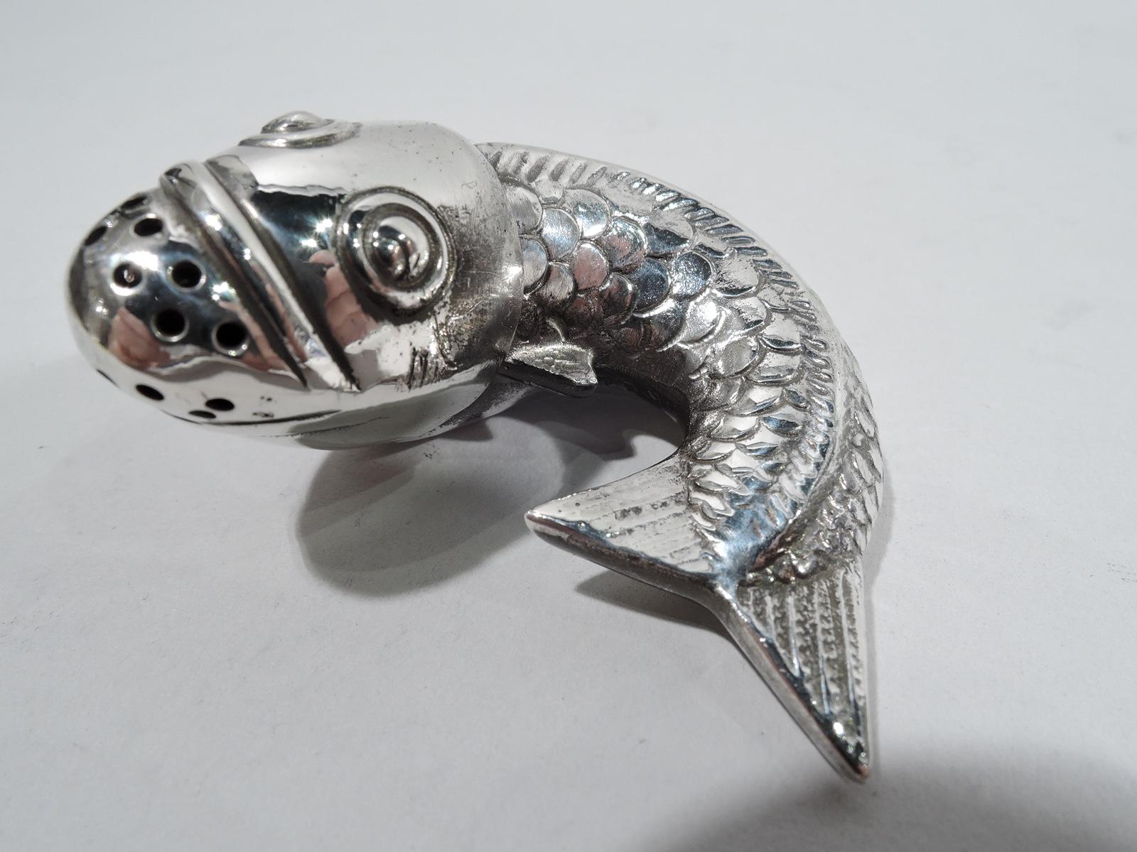 Pair of German Japonesque 800 silver figural salt and pepper shakers, ca 1920. Each: Koi fish form with scaly body and sharp fins. Detachable head with exophthalmic eyes and pierced mouth. Marked. Total weight: 2.3 troy ounces.
