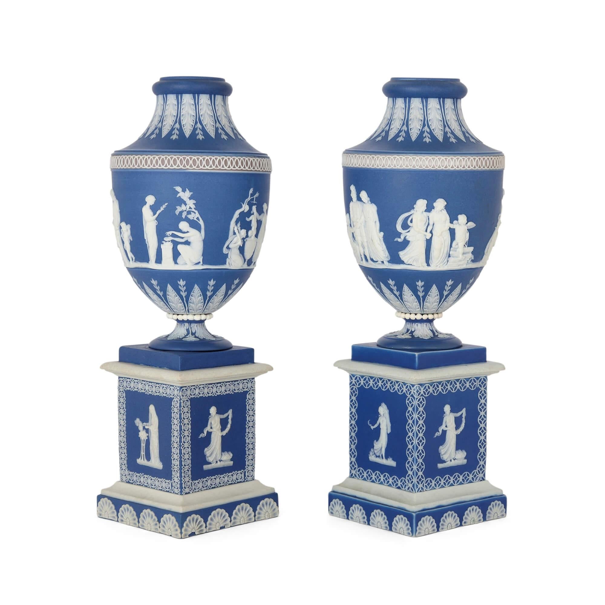 Pair of antique jasperware vases by Adams Pottery, circa 1780
English, c. 1780
Height 27cm, diameter 10cm

This remarkable pair of neoclassical blue jasperware vases stands as a testament to the sublime artistry and finesse of William Adams, an