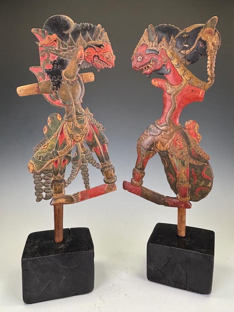 Pair of Antique Javanese Wayang Golek Shadow Puppets on Stands, Early 20th Century
A finely carved pair of Wayang Golek wooden shadow puppets from Java, Indonesia, dating to the early 20th century, now presented on bespoke display stands.

Unlike