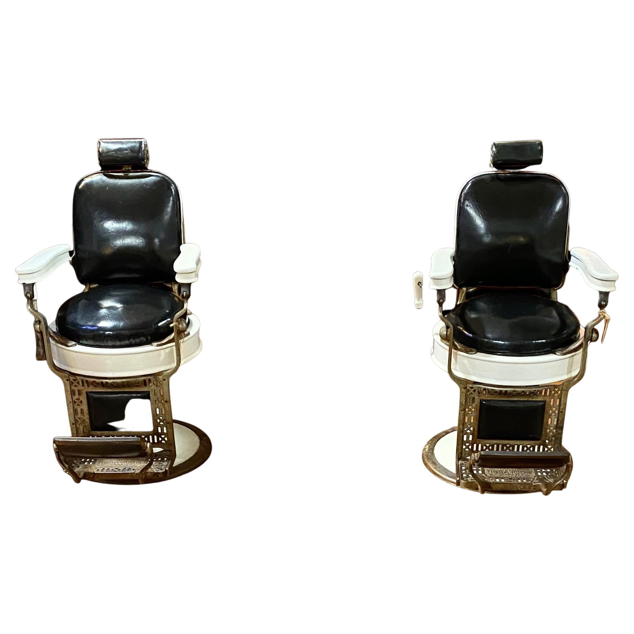 Pair Of Antique Kochs, Chicago Porcelain reclining Adjustable Barber Chairs
Single pedestal swivel barbers chair on circular chrome and white enamel base with pivoting footrest, white enamelled arms, black leather upholstered circular seat, square