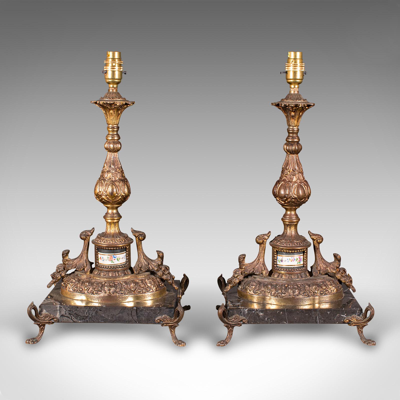 
This is a pair of antique lamp bases. A French, gilt metal and marble wired table light, dating to the Edwardian period, circa 1910.

Delightfully ornate lamp bases of substantial proportion
Displaying a desirable aged patina and in good order
Gilt