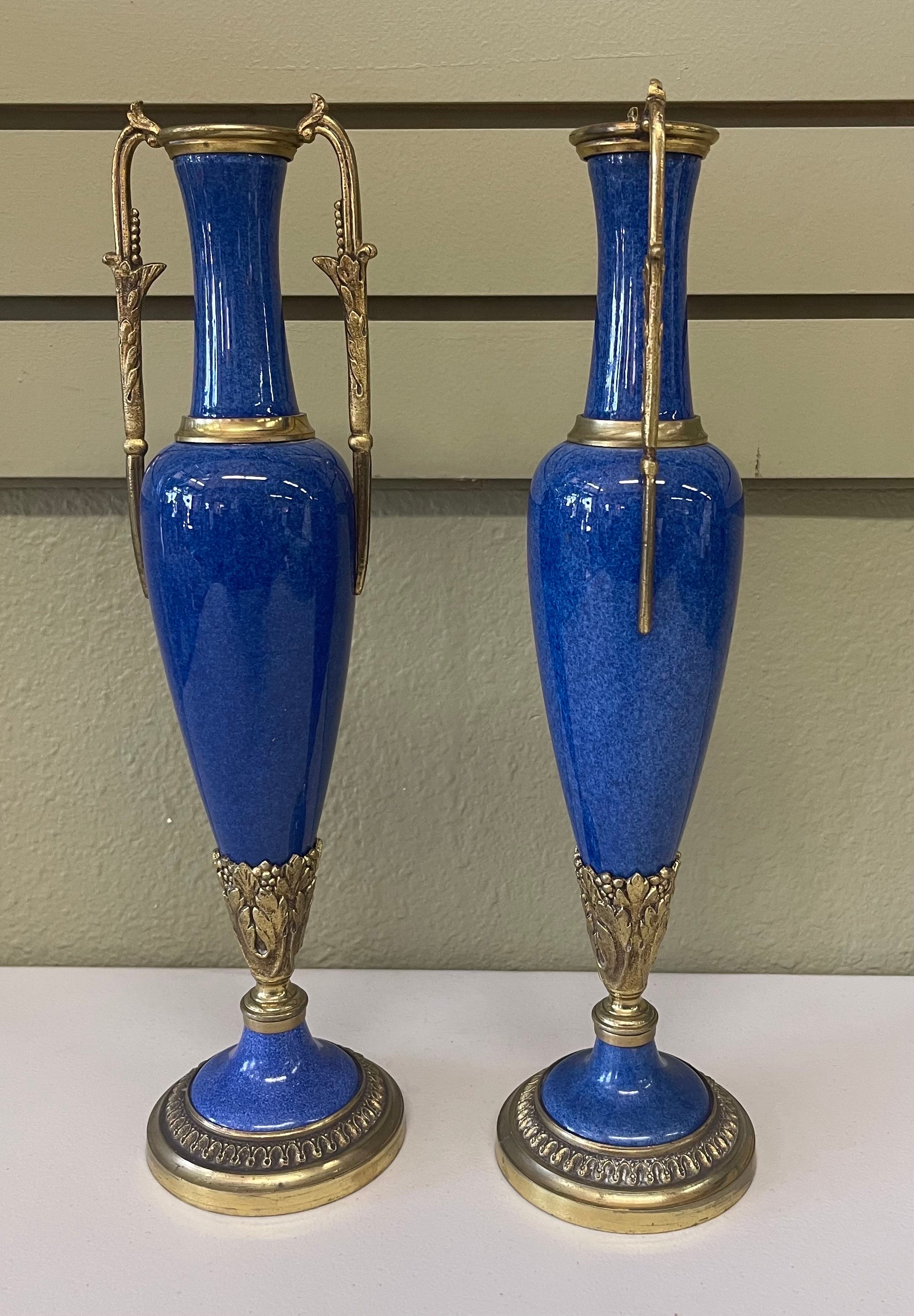 Exquisite pair of lapis blue porcelain and brass garnitures by Sevres of France, circa late 1800s. The set is in very good antique condition with no chips or cracks. Gorgeous pair! #2209.