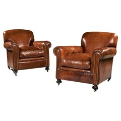 Pair of Antique Leather Club Armchairs on Bun Feet