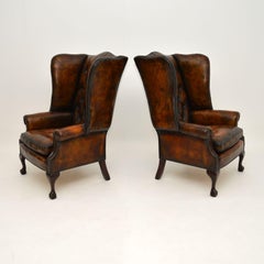 Pair of Antique Leather Wing Back Armchairs