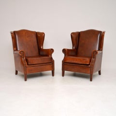 Pair of Antique Leather Wing Back Armchairs