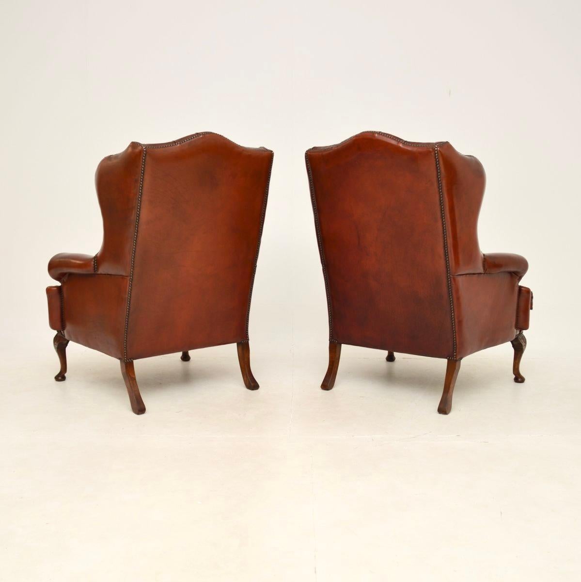 British Pair of Antique Leather Wing Back Armchairs For Sale