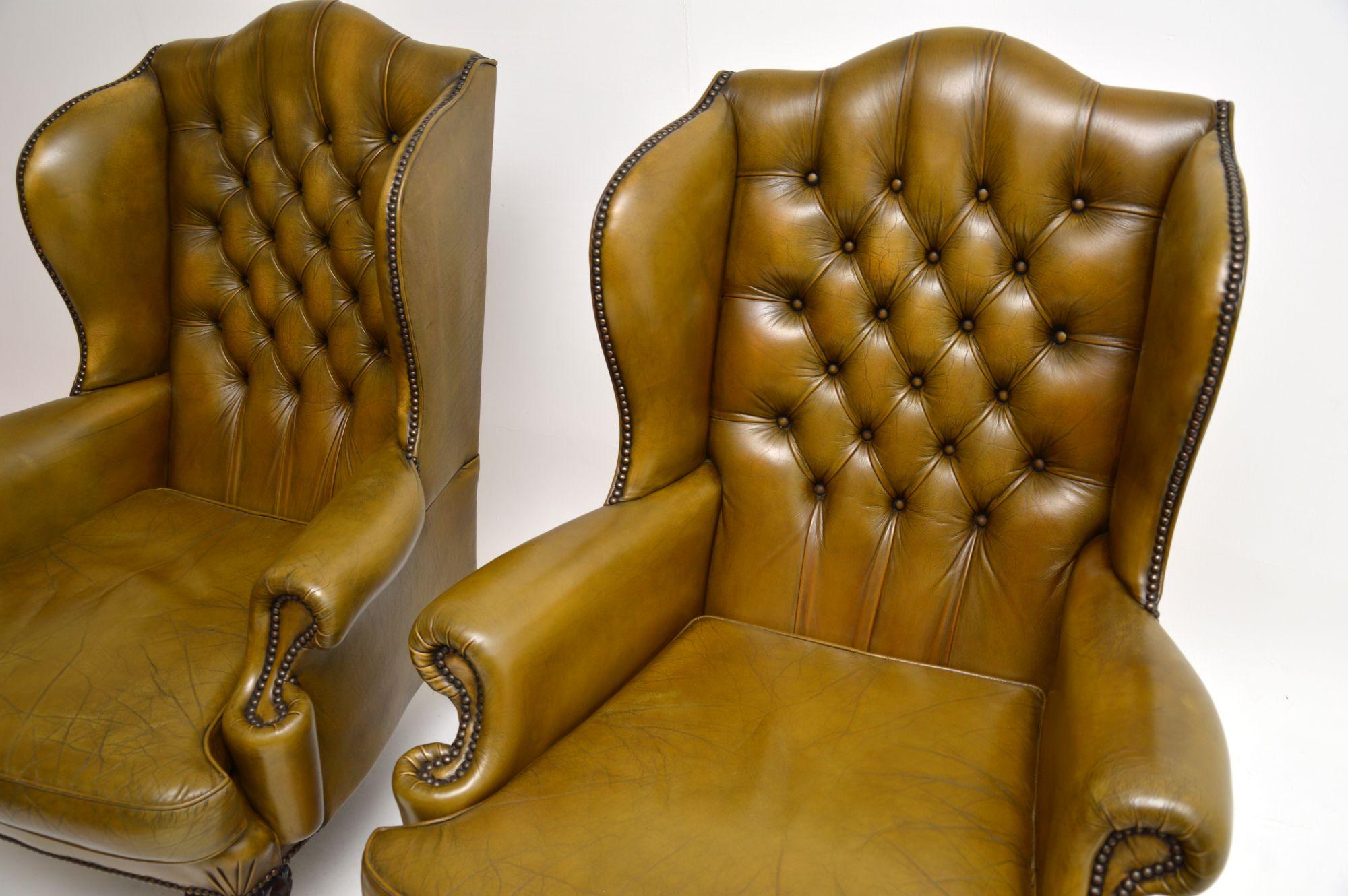 Pair of Antique Leather Wing Back Armchairs For Sale 1
