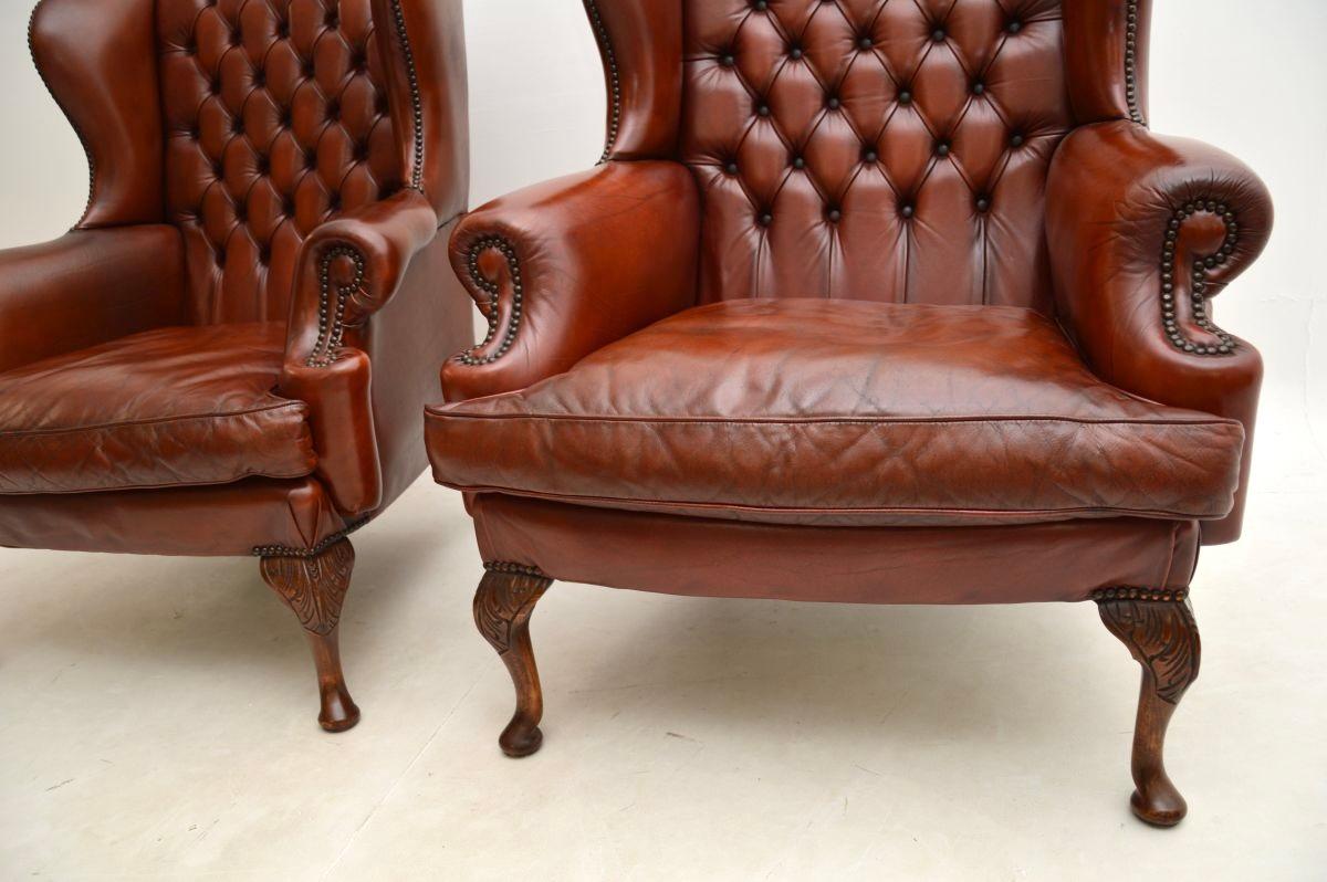 Pair of Antique Leather Wing Back Armchairs For Sale 1