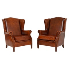 Pair of Antique Leather Wing Back Armchairs