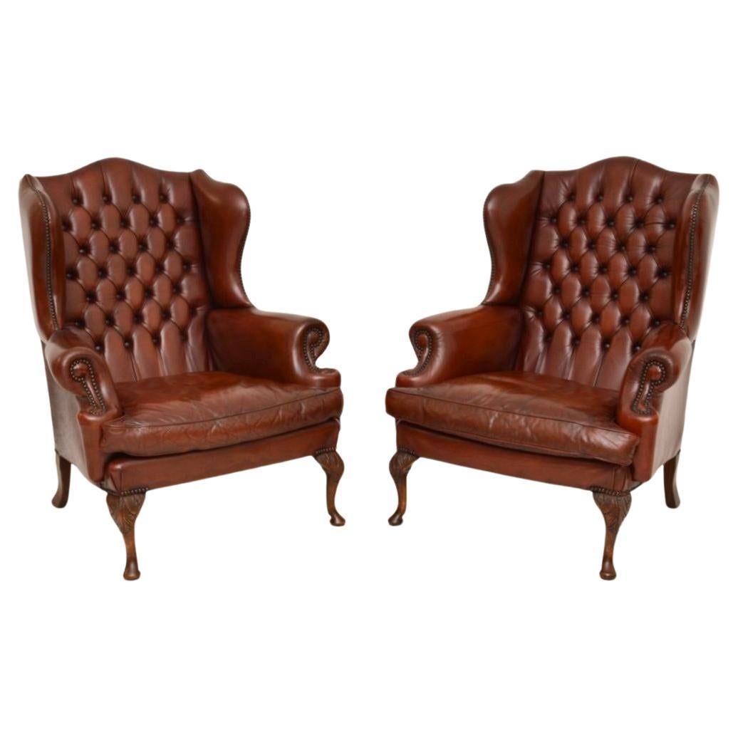 Pair of Antique Leather Wing Back Armchairs For Sale
