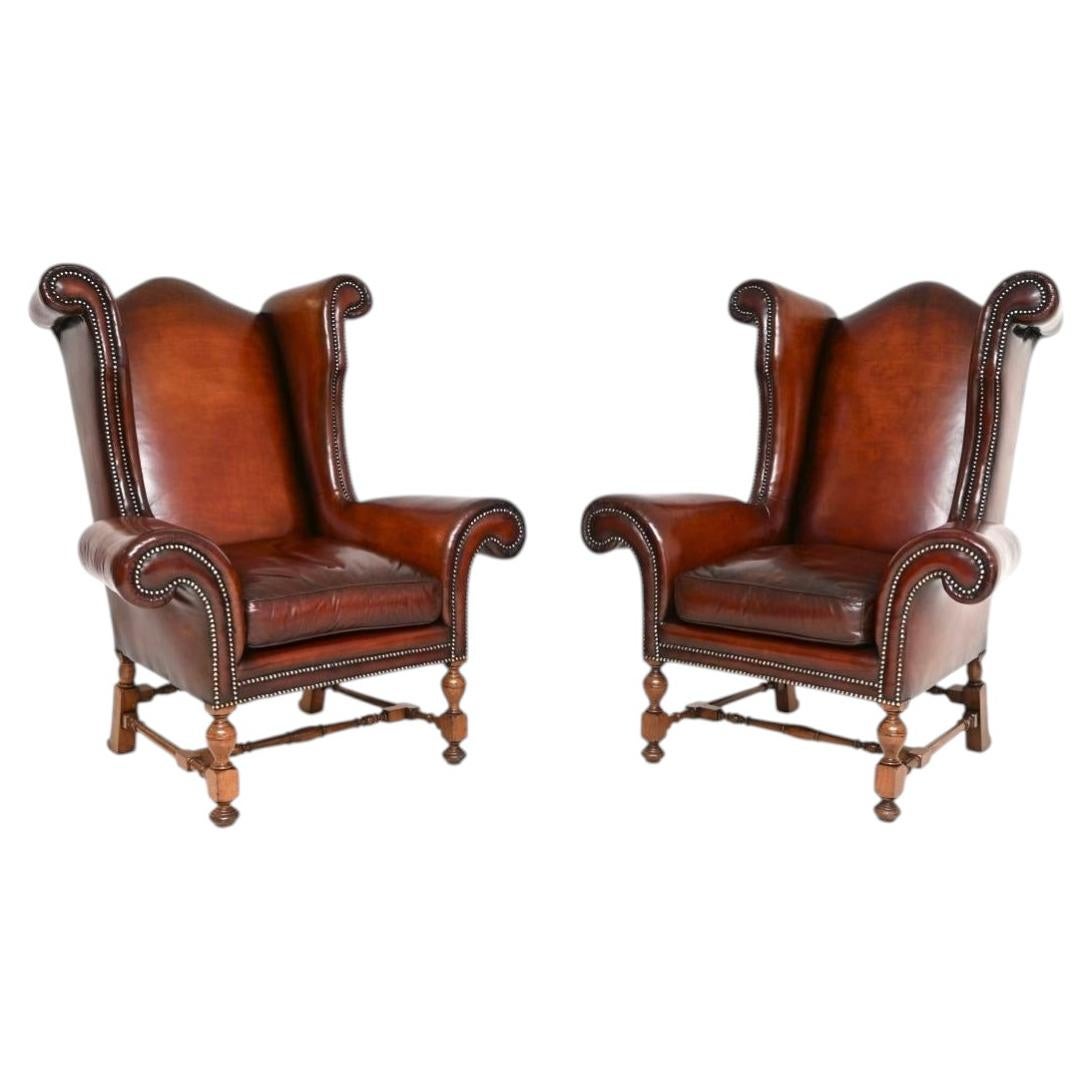 Pair of Antique Leather Wing Back Armchairs