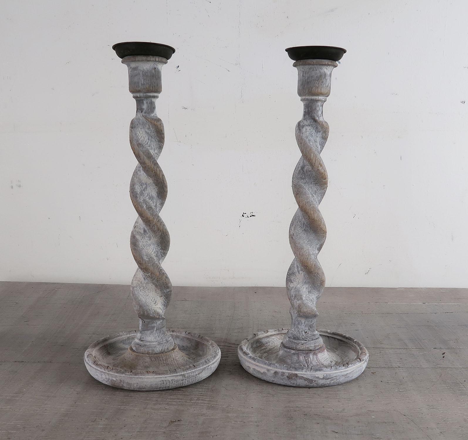 A super pair of limed oak twist candlesticks.

They have been recently limed to enhance the beautiful grain in the oak.

The brass sconces are original.


 