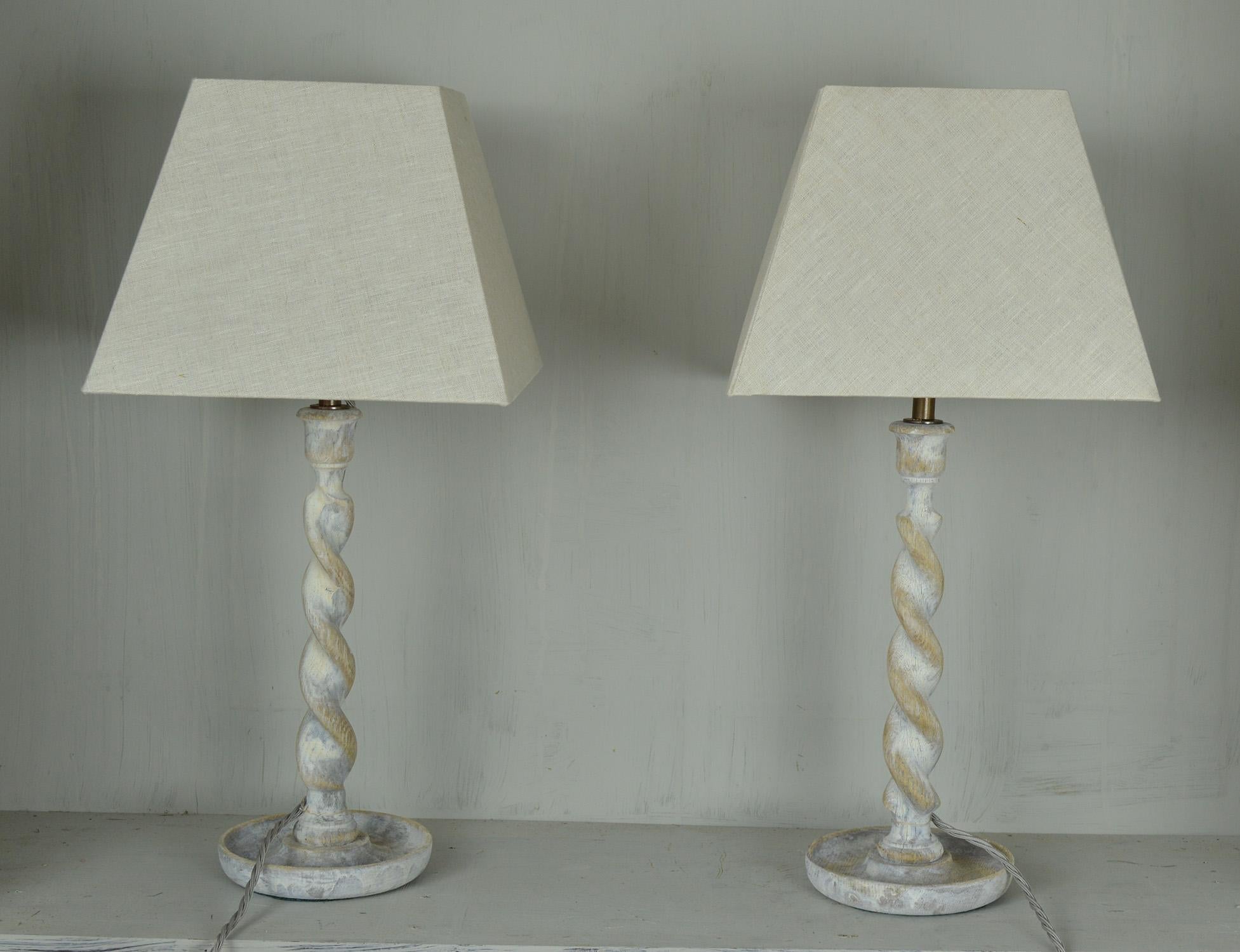 Super pair of limed oak barley twist table lamps.

Converted from candlesticks.

The oak has been recently limed to enhance the beauty in the grain of the oak.

The shades are linen.

Professionally wired to UK standards.
 