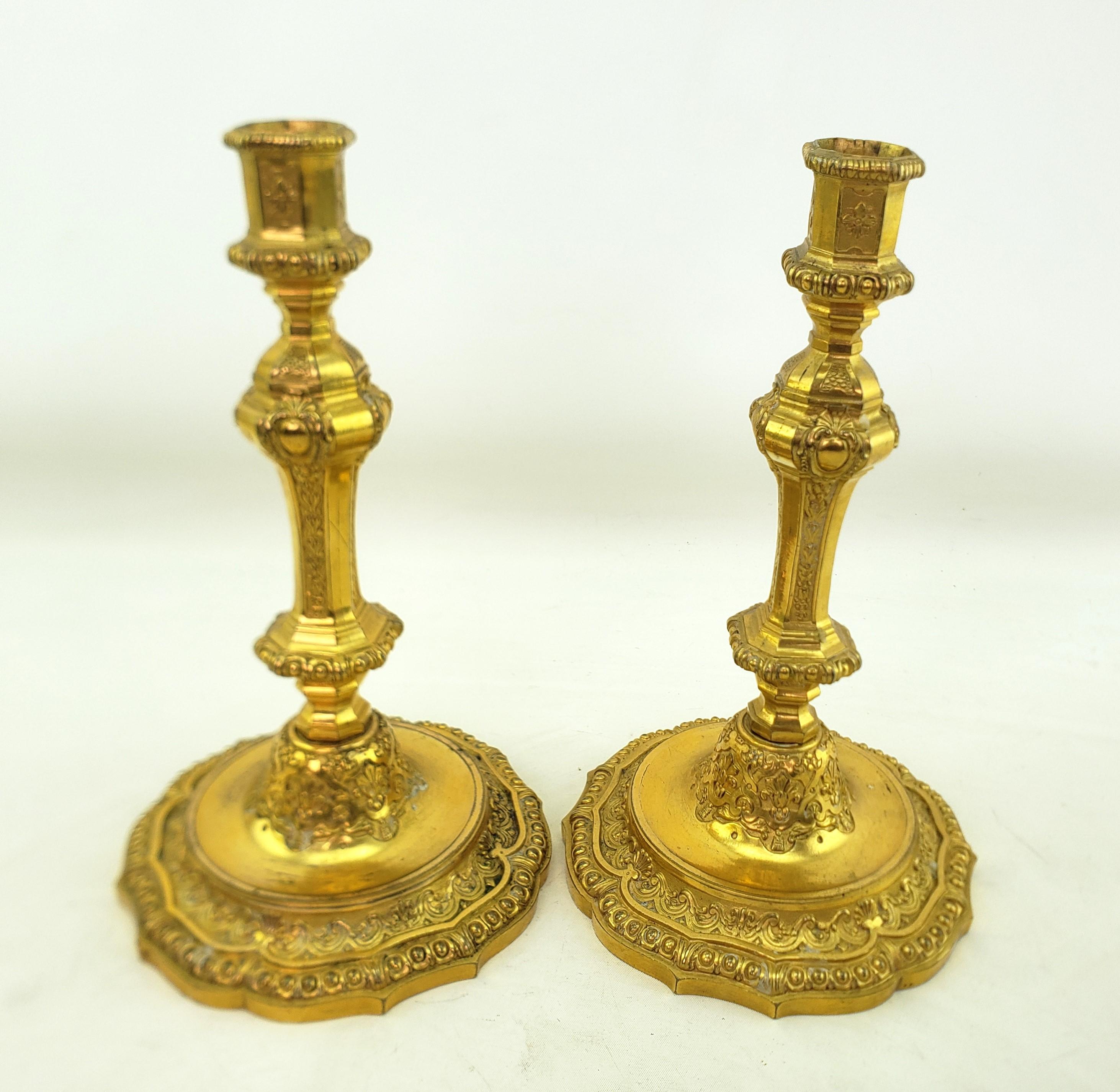 Cast Pair of Antique Louis XIV Styled Gilt Bronze Candlesticks with Stylized Flowers For Sale