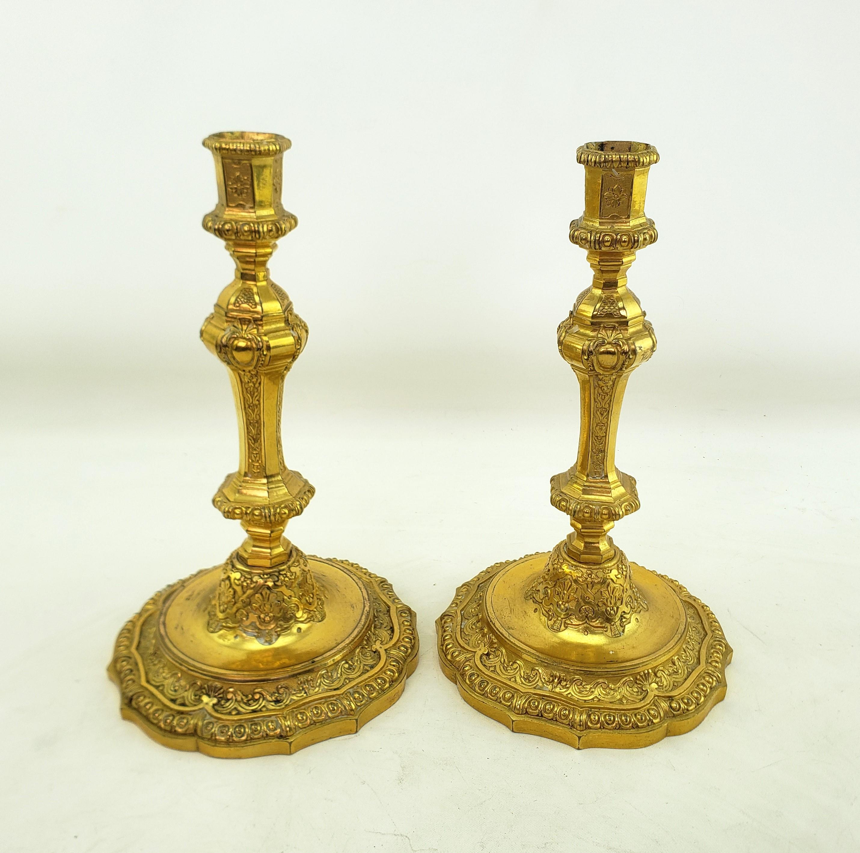 19th Century Pair of Antique Louis XIV Styled Gilt Bronze Candlesticks with Stylized Flowers For Sale