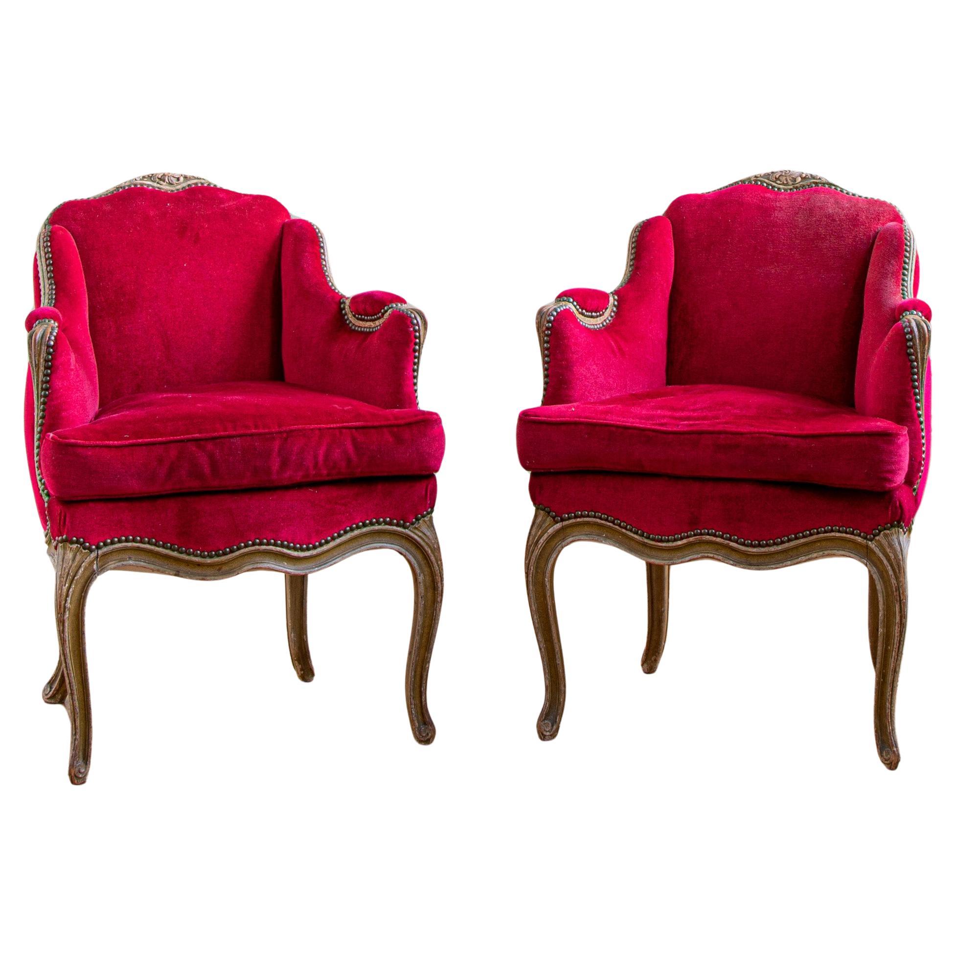 A distinctive pair of French, Louis XV Style, Bergere Armchairs, circa 1900. Hand carved in solid beech and originally painted in a warm French grey but  the paintwork has now nicely faded to reveal some of the the aged wood work beneath. 
The
