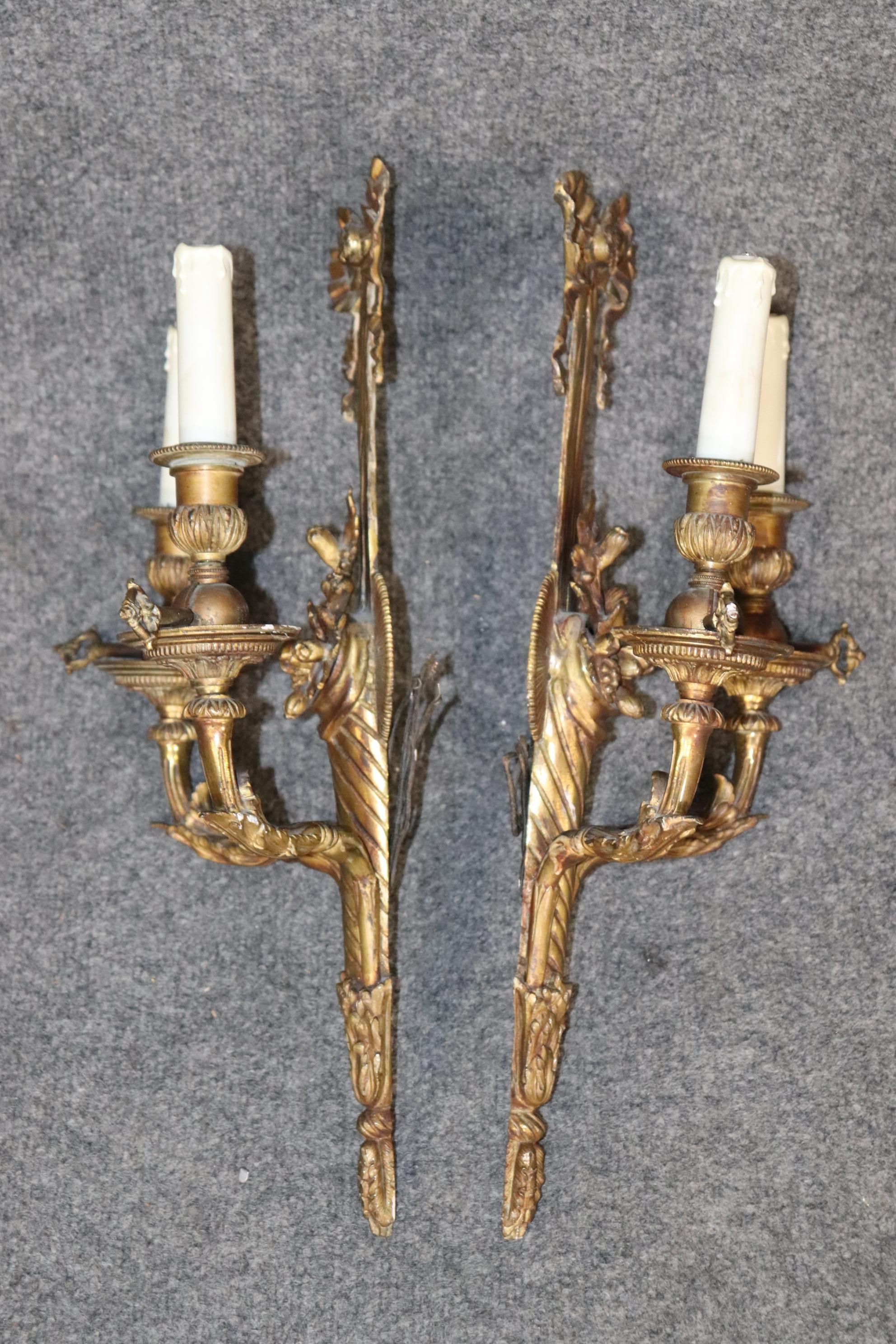Dimensions- H: 19in W: 11 1/2in D: 5 1/4in
This Pair Antique Louis XV Style French Brass Wall Sconces are made of the highest quality and are a fine example early 20th century french decor. This pair is from the 1920's and is made of brass. If you