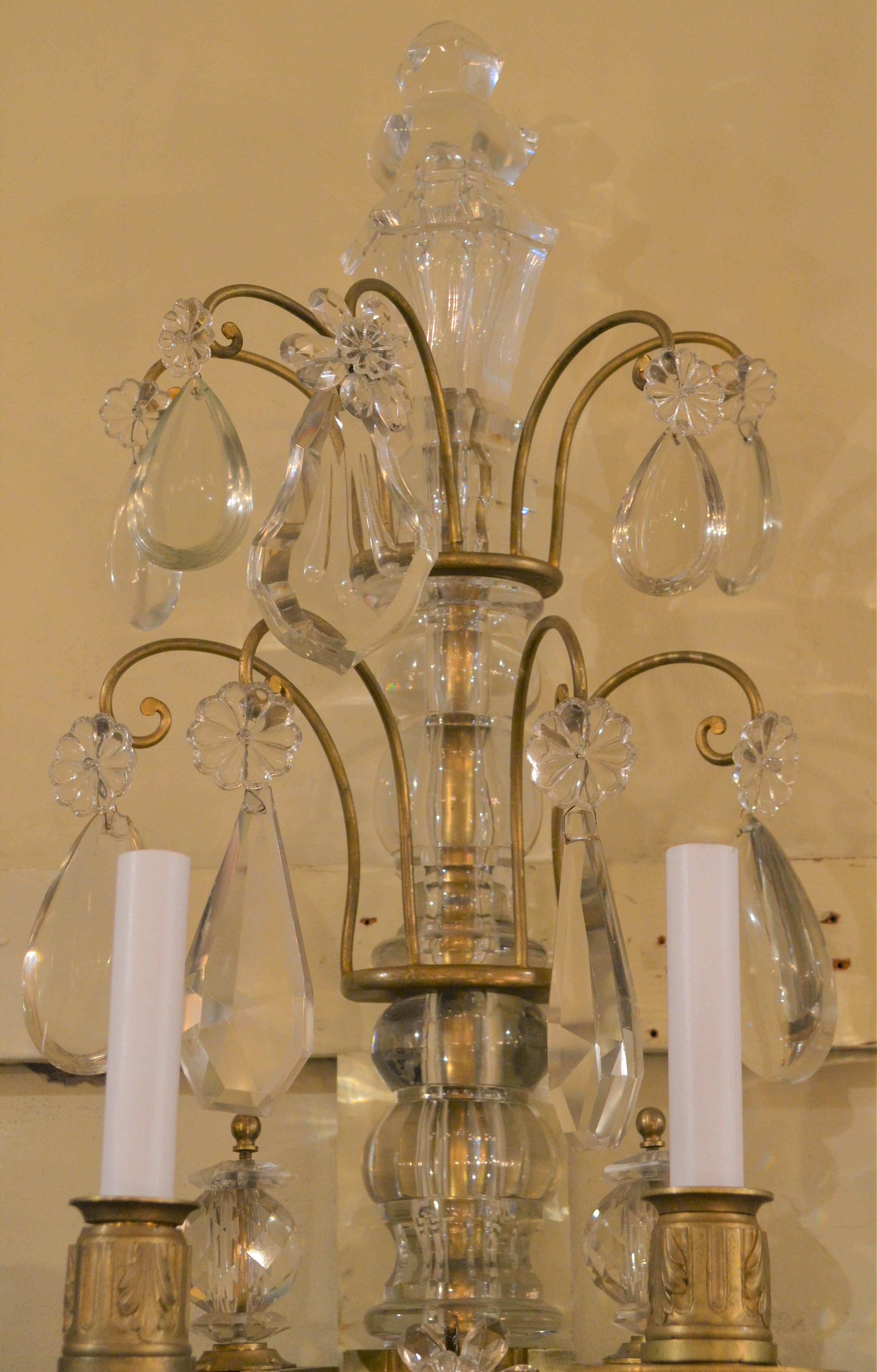 These sconces stand over three feet high and are exceptional in design. The old Baccarat crystal shimmers and the ormolu finish remains strong.