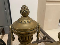 Pair of Antique Louis XVI Style Fire-Gilded Bronze Chenets with Urn Finials