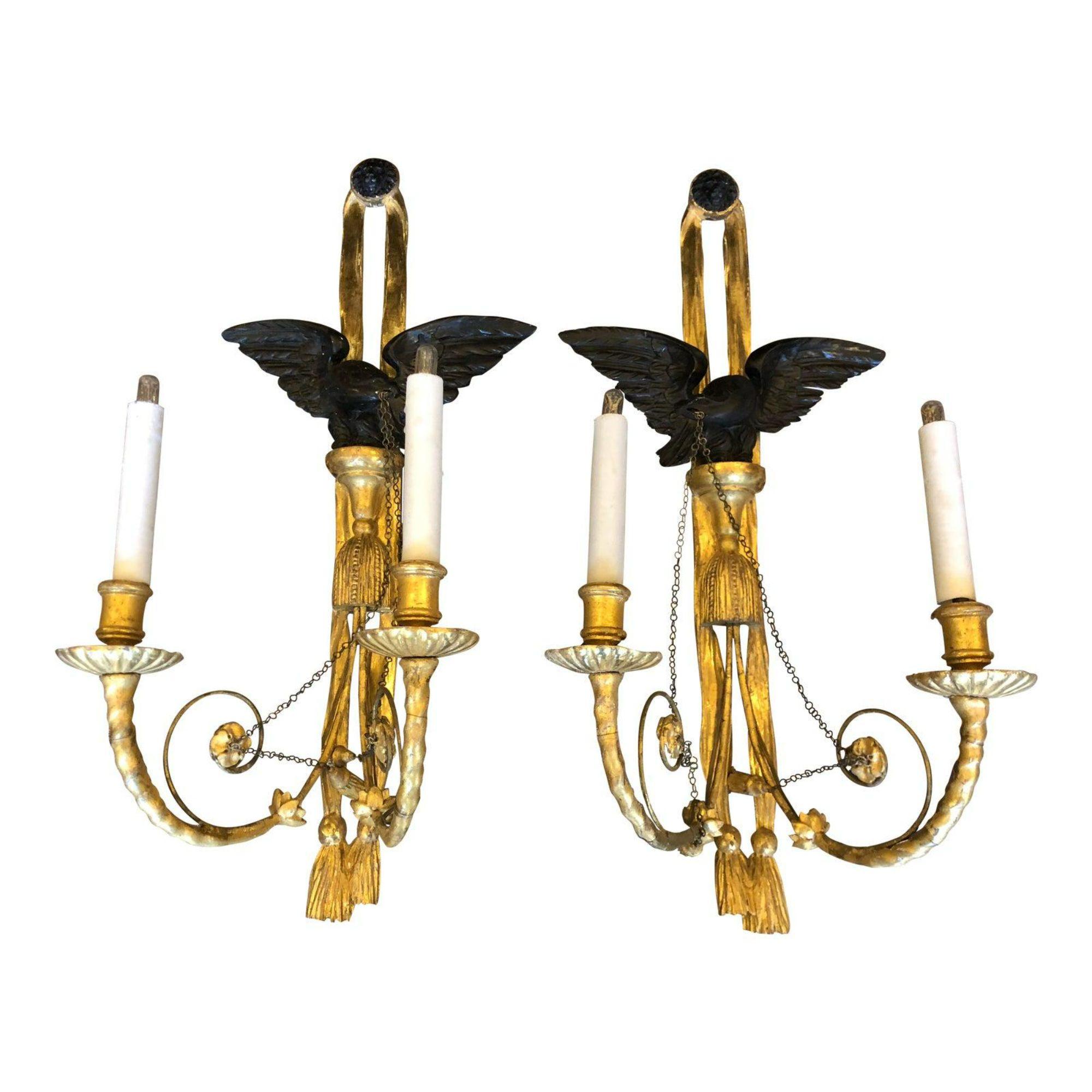 Pair of Antique Louis XVI Style giltwood wall sconces

Additional information: 
Materials: Wood
Color: Gold
Period: early 19th century
Place of Origin: France
Styles: Federal
Lamp Shade: Not Included
Power Sources: Up to 120V (US Standard),