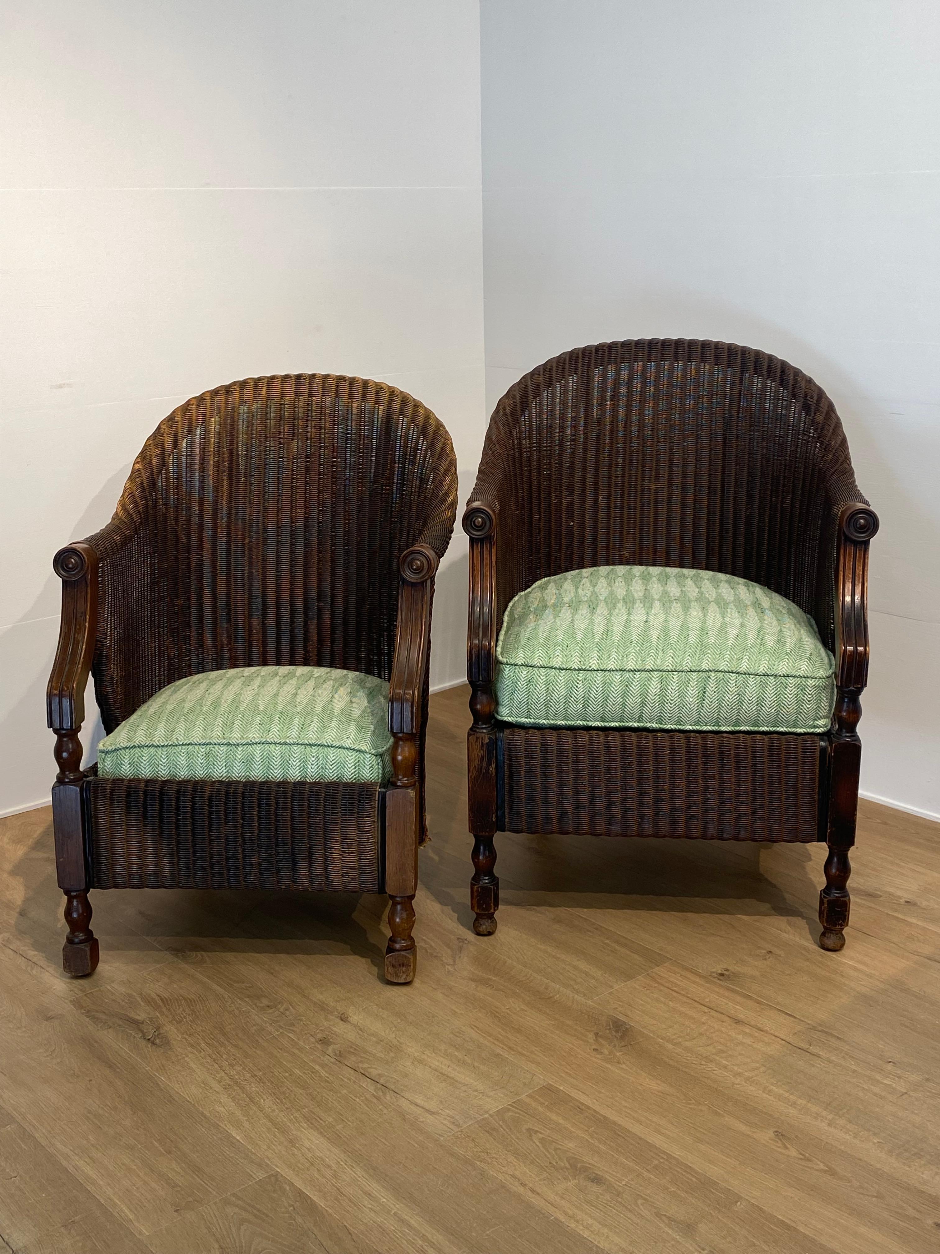British Pair of antique Loyd Loom Chairs In Rattan For Sale