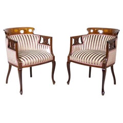 Paire de fauteuils anciens en acajou avec sièges tapissés et rayés, vers 1900