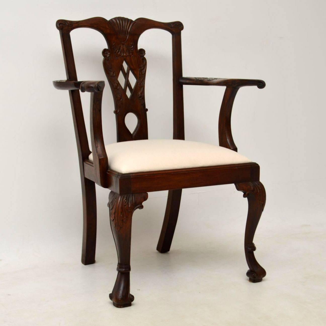 This pair of antique Chippendale style mahogany carver chairs have a matching set of four single chairs also on the site at the moment. This pair like the singles are in excellent condition and have very generous proportions. They are beautifully