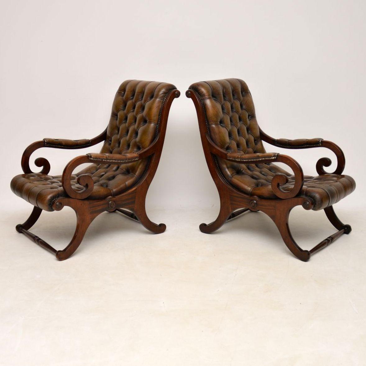 Pair of antique deep buttoned leather and mahogany ‘slipper’ armchairs’ in good condition. The leather upholstery has a wonderful original colour and loads of character. It’s deep buttoned and hand tacked onto the mahogany frames. These chairs are
