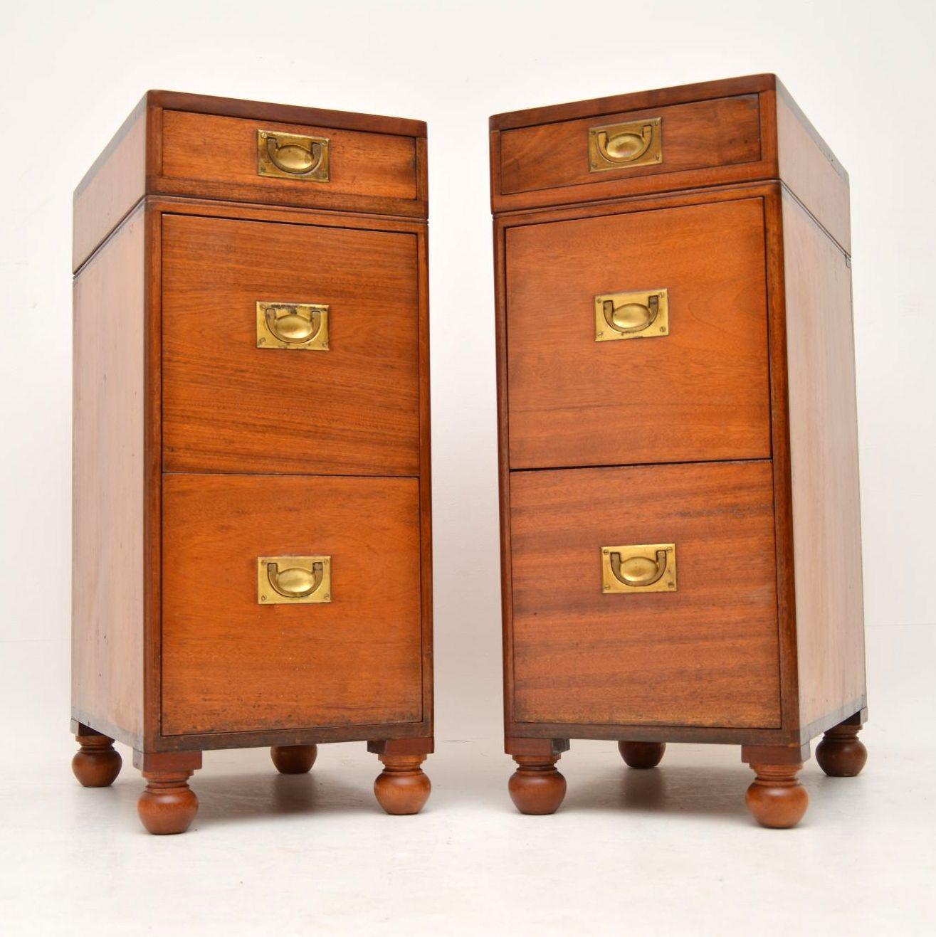 Large pair of antique mahogany naval Campaign style bedside chests, which could be used for other purposes. I would date these to circa 1890s period and they are in excellent condition. Two of the drawers are very deep and they all have the original