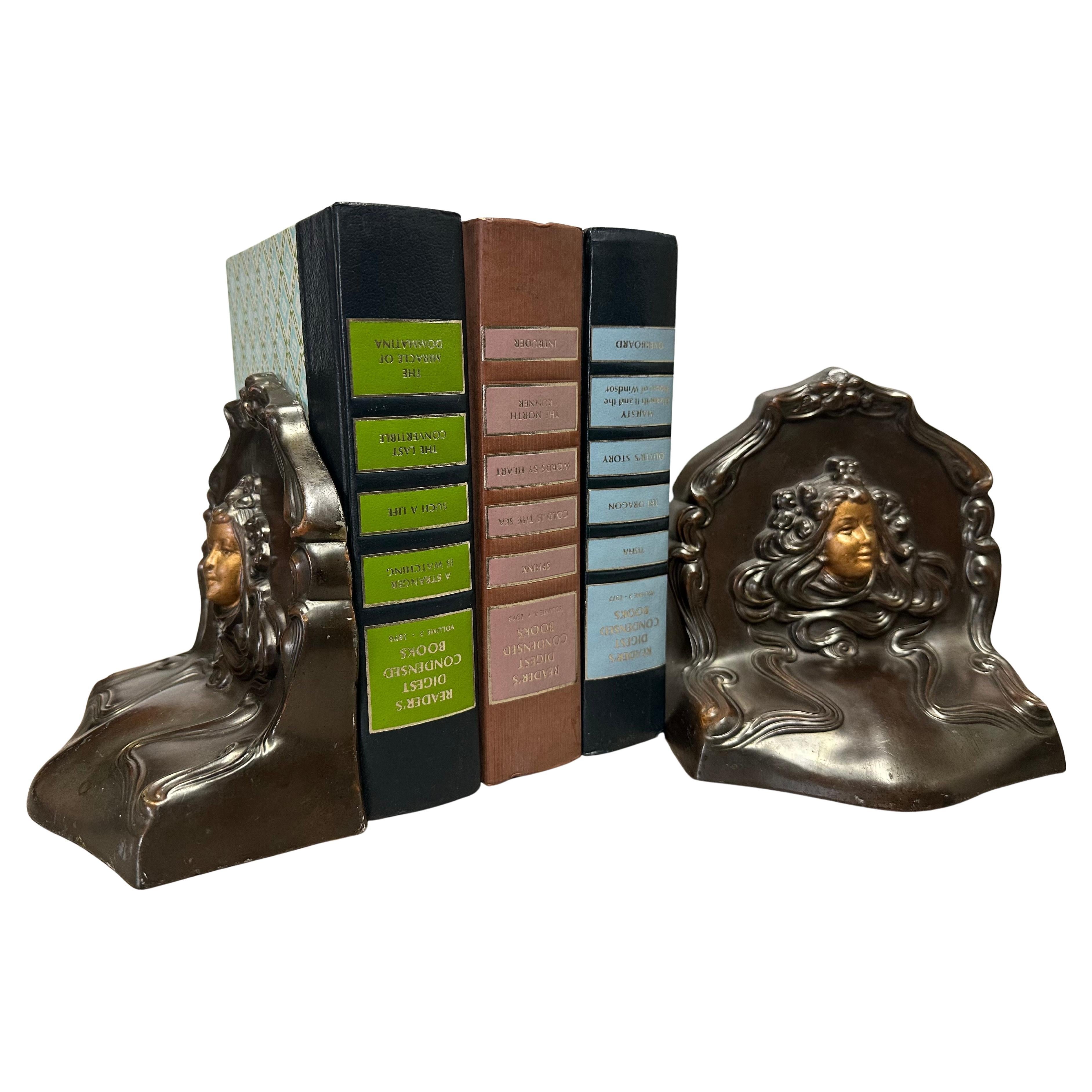 Squisita coppia di fermalibri antichi in stile art nouveau 