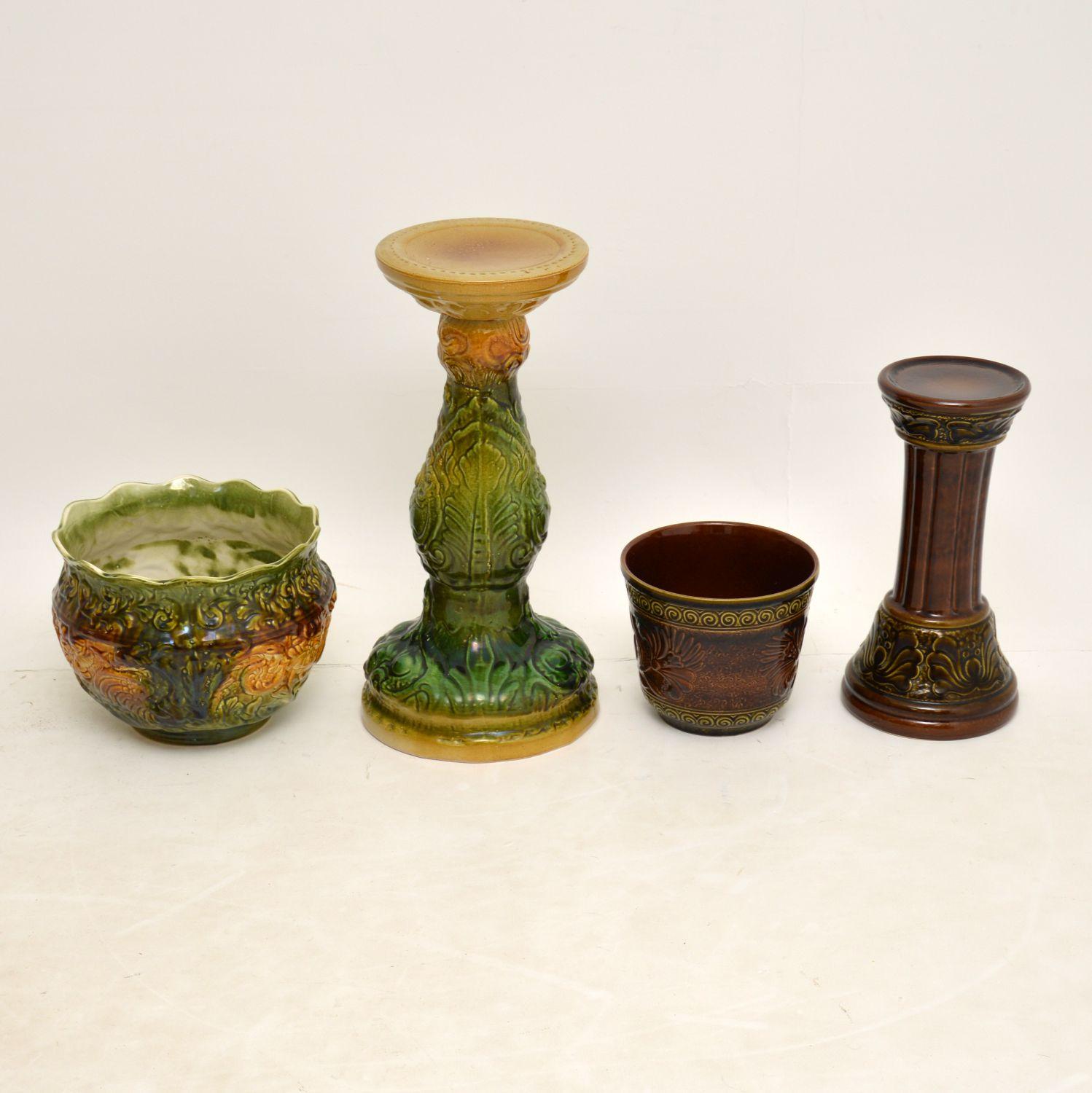 A stunning pair of antique and vintage porcelain plant stands. These are quite different in style and age, but they sit very nicely together.

Both are beautifully made with stunning colours, they both have a plant pot that sits on top of a
