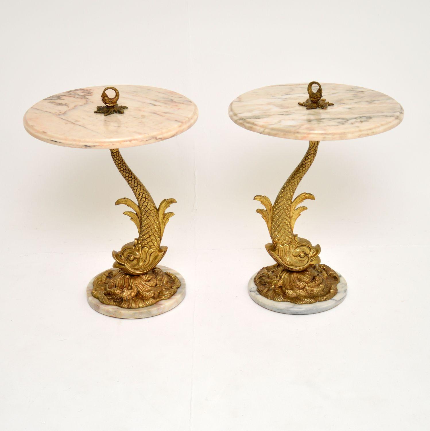 A stunning and unusual pair of antique side tables, dating from circa 1930s. These were most likely made in France, they are of amazing quality and have a fantastic detailed design.

The supports are solid brass and are made in the images of sea