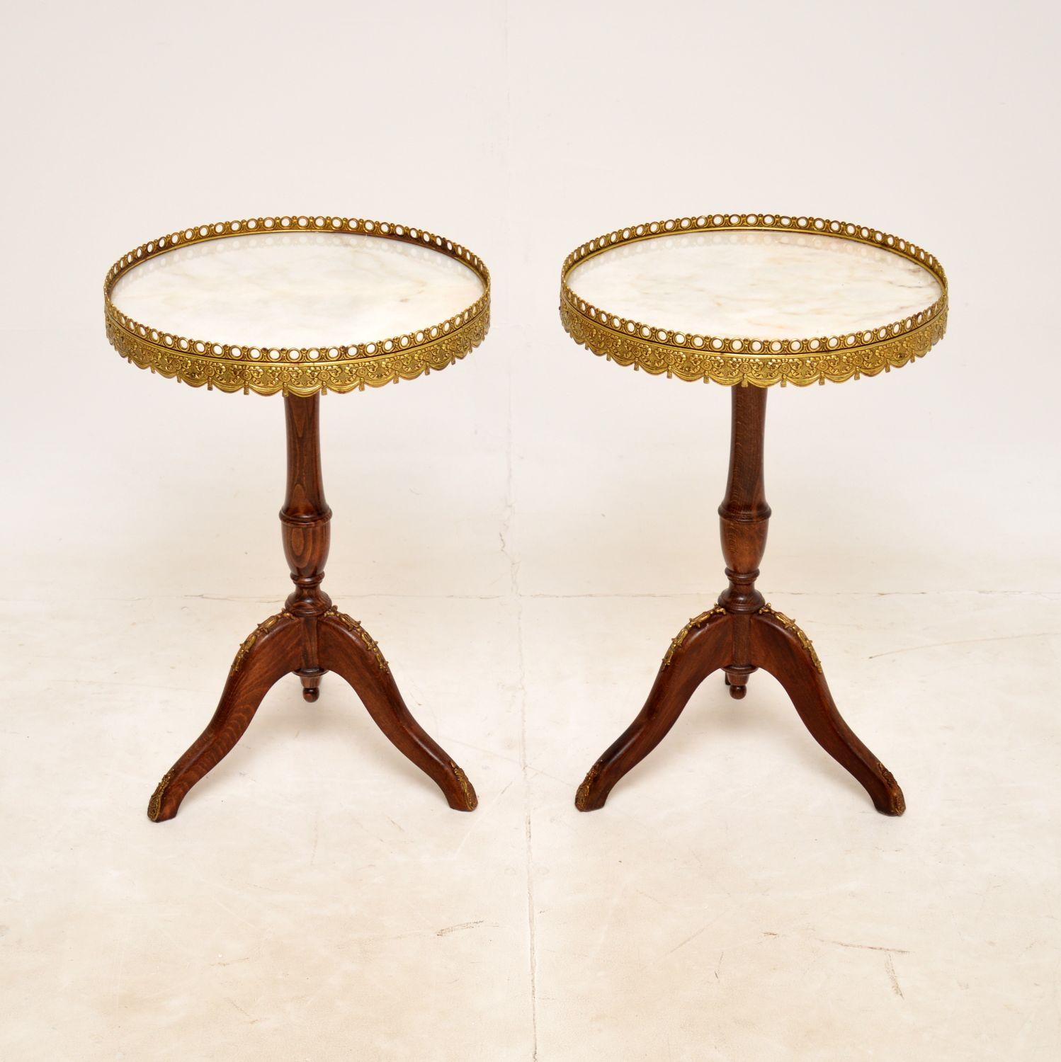 A stunning and very well made pair of antique marble top wine tables in the French style and dating from around the 1930-50’s.

The quality is exceptional, and they are a very useful size. The frames are solid wood, with beautiful gilt metal
