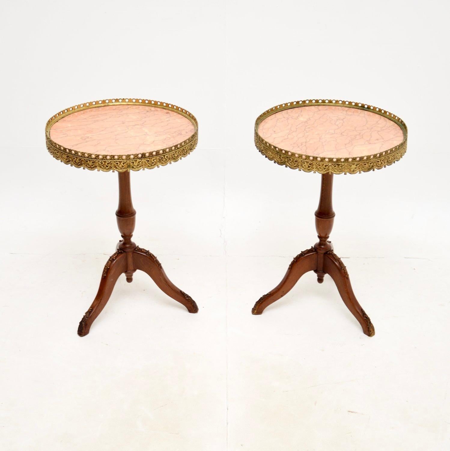 A stunning and very well made pair of antique marble top wine tables in the French style, dating from around the 1930’s.

The quality is exceptional, and they are a very useful size. The frames are solid birch, with beautiful gilt metal mounts, the