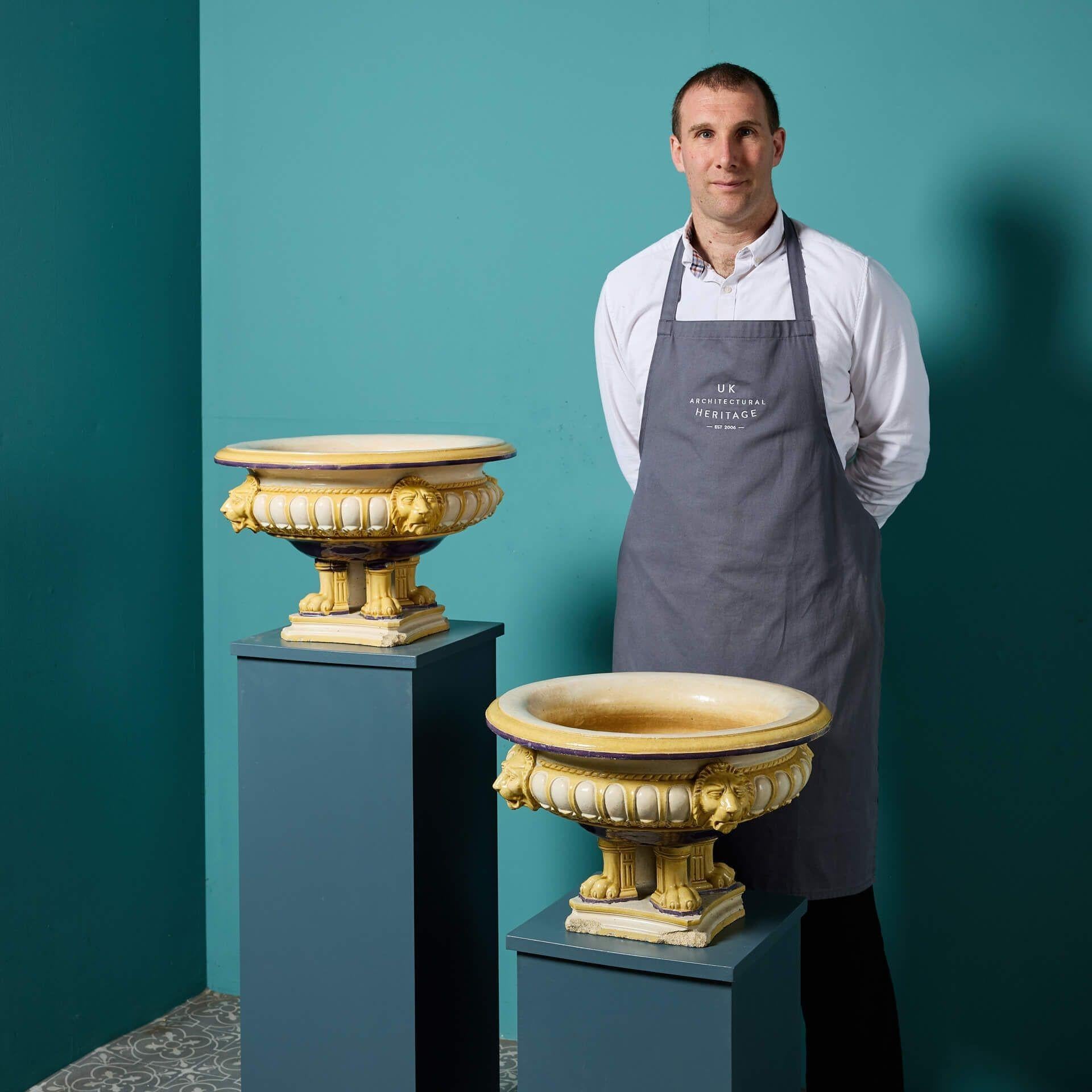 A rare pair of antique Maw & Co glazed jardinieres circa 1860, each impressed with ‘Maw & Co Broseley’ to the base.

Made from stoneware, each planter is of a matching design and unusually glazed in contrasting ochre yellow and purple colours. Their